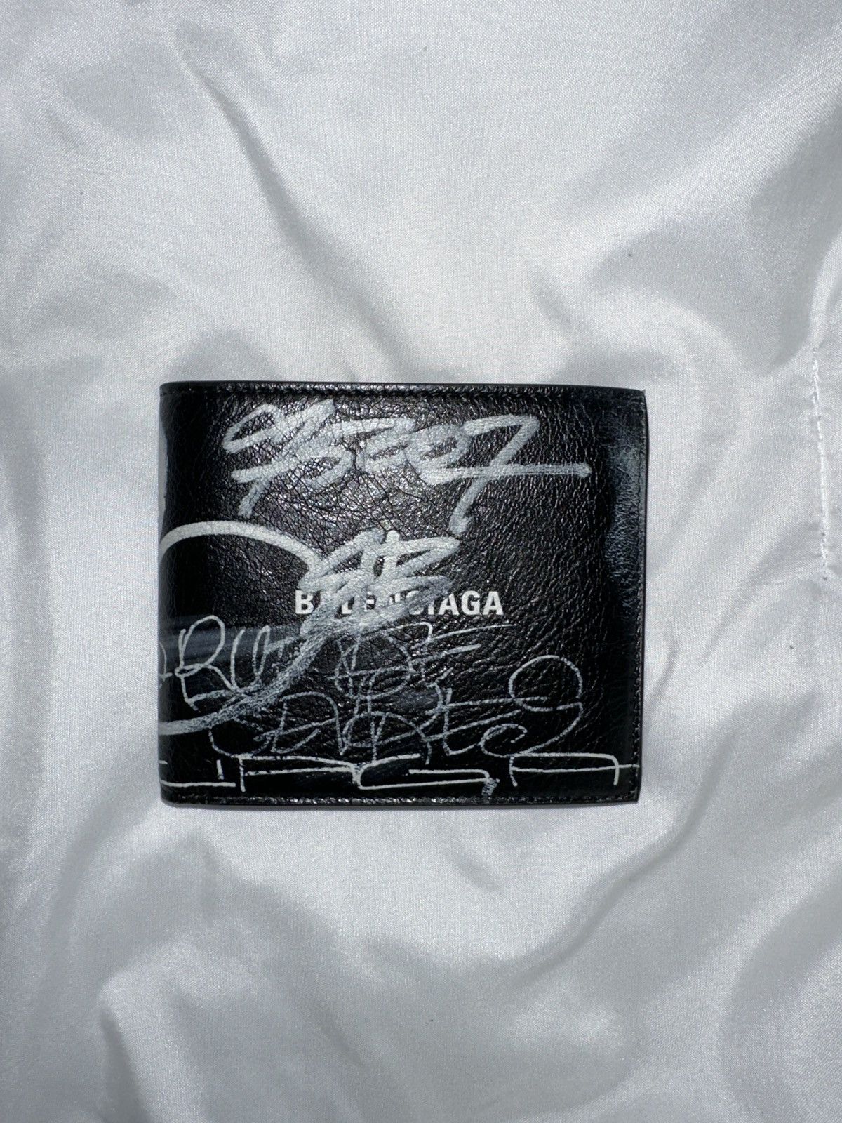 image of Balenciaga Graffiti Print Leather Bifold Wallet in Black, Men's