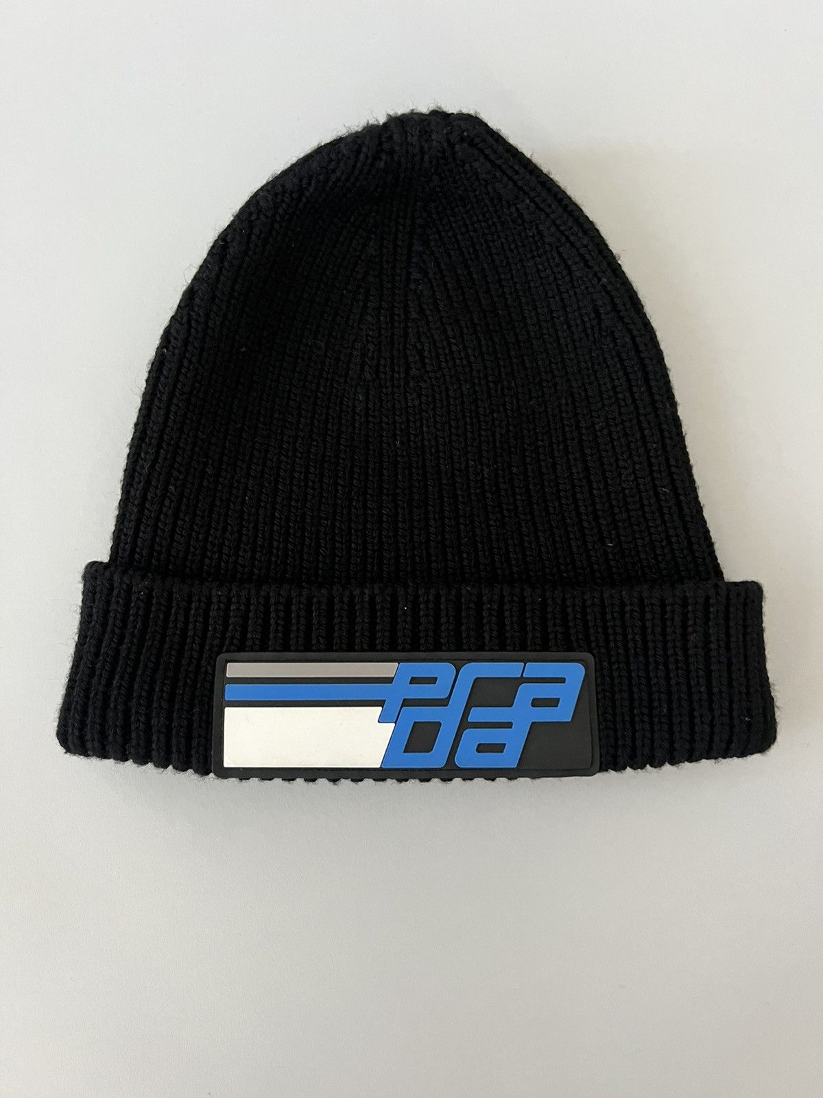 image of Prada Wool Beanie With Rubber Patch in Black, Men's