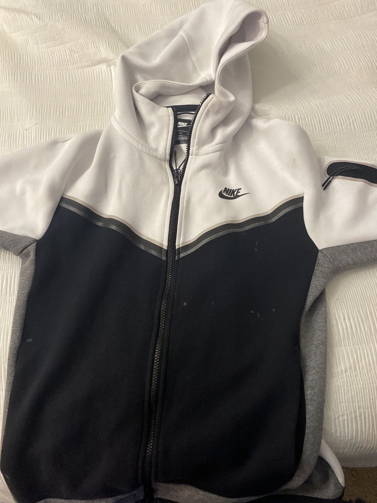 white and black nike tech kids