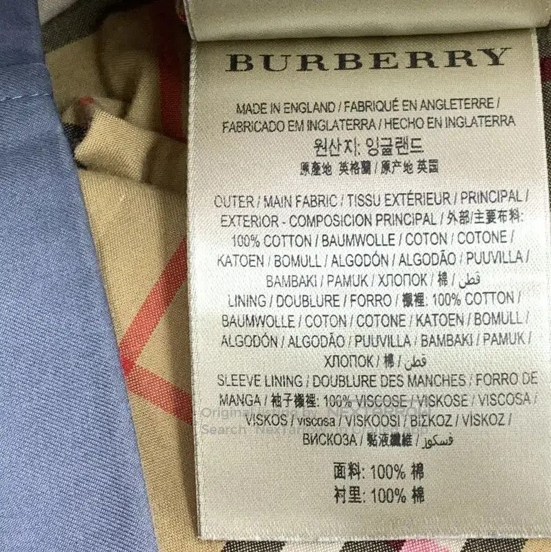 Burberry Women's Dark Blue Cotton Trench Coat.