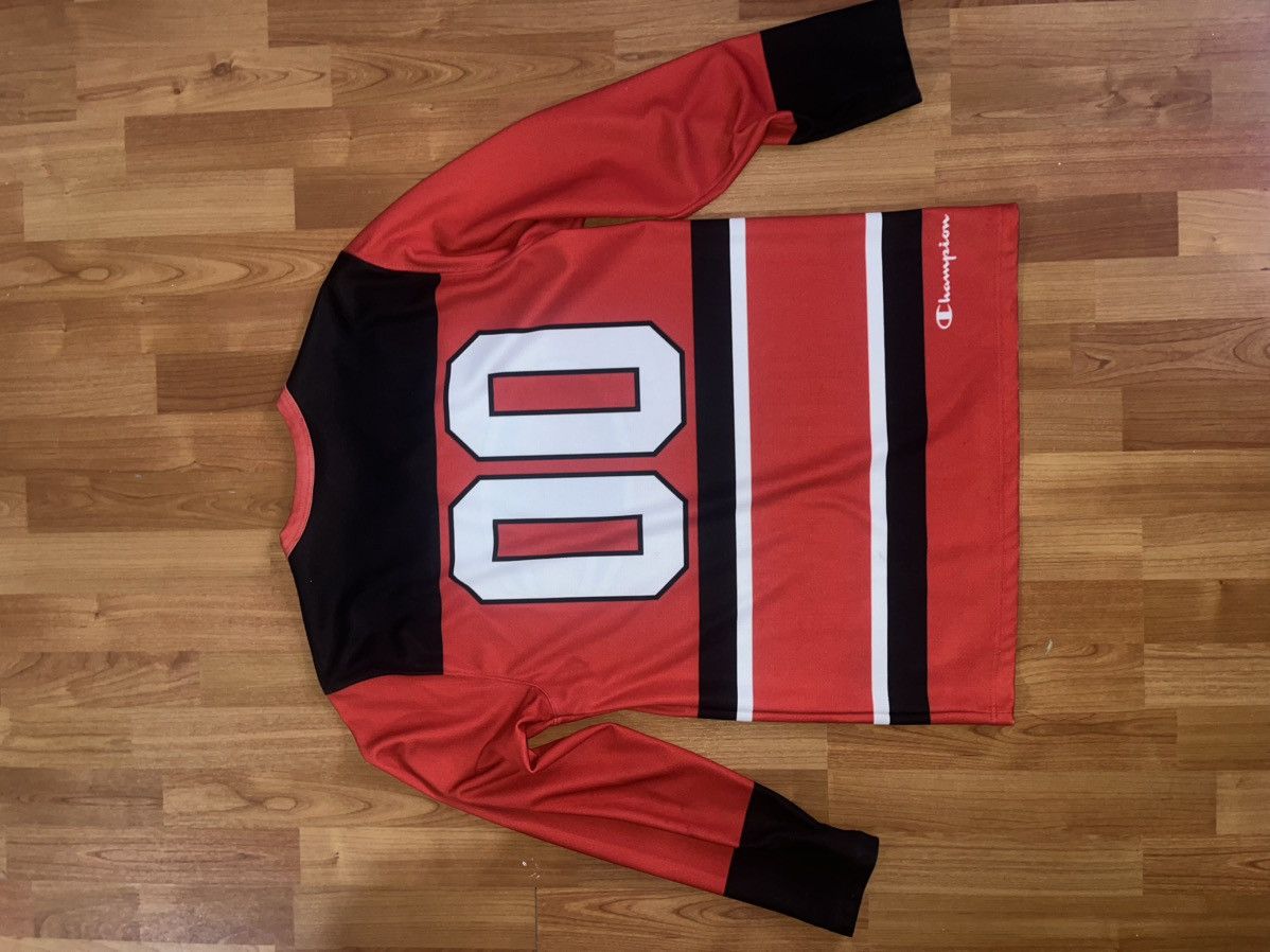 Champion × Supreme Red Supreme champion jersery Size medium Size US M / EU 48-50 / 2 - 4 Thumbnail