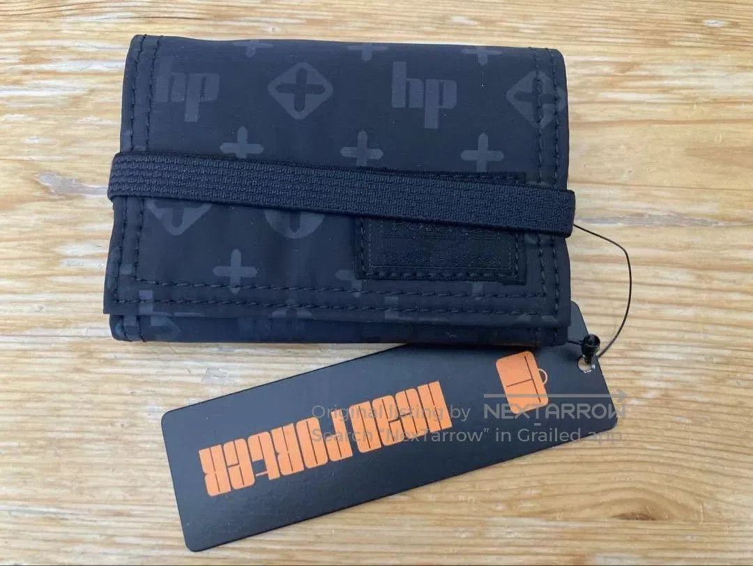 sleek head porter trifold wallet.