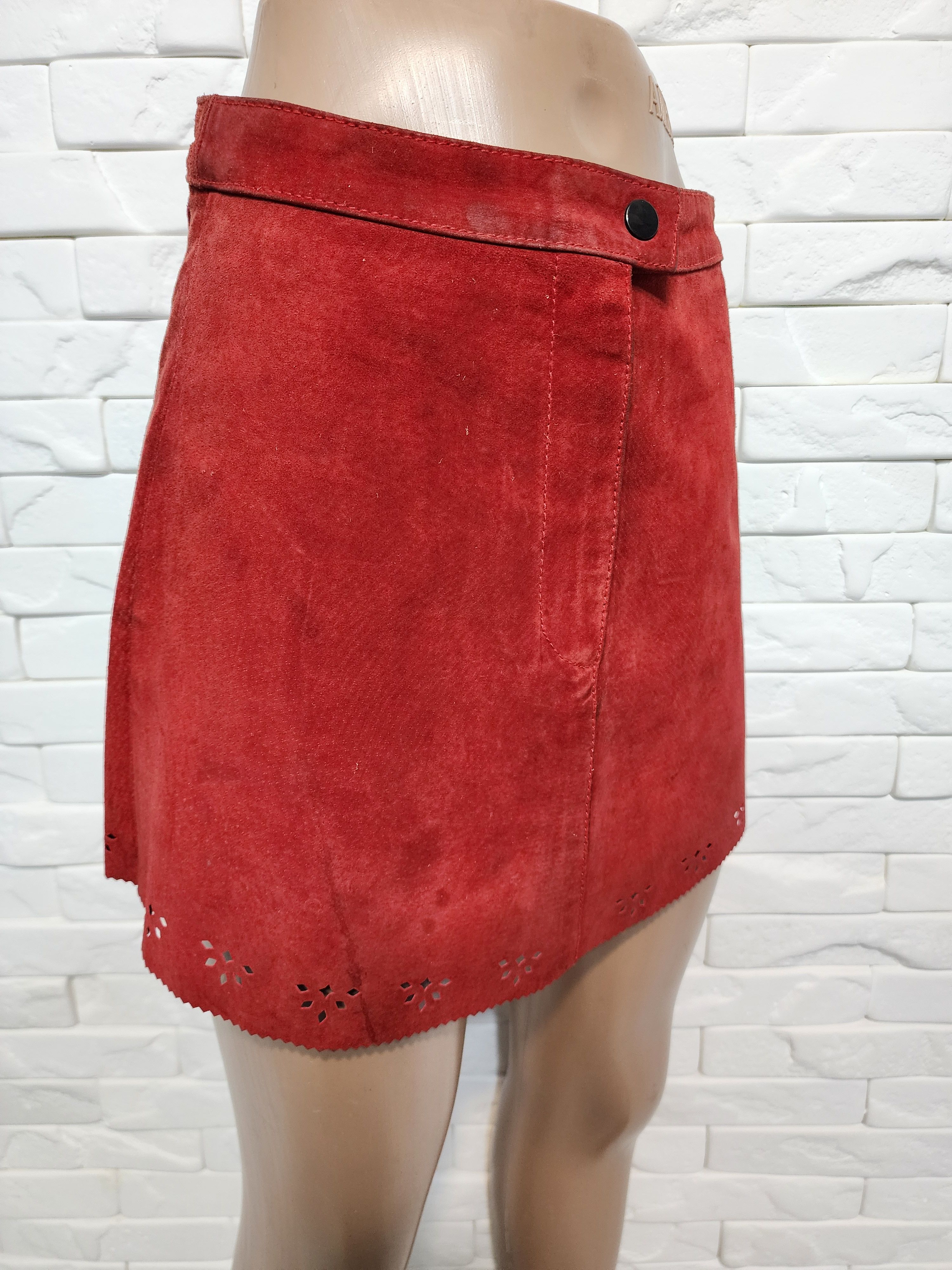 Red skirt made of genuine suede with perforation.
