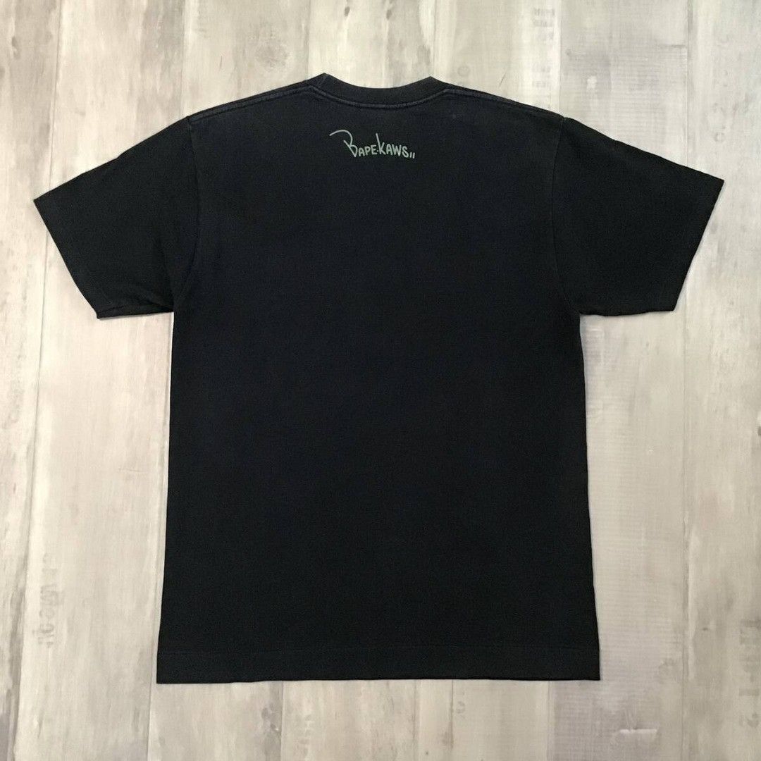 Bape × Kaws BAPE × KAWS 1st camo green bendy NYC college logo T-shirt Size US M / EU 48-50 / 2 - 4 Thumbnail
