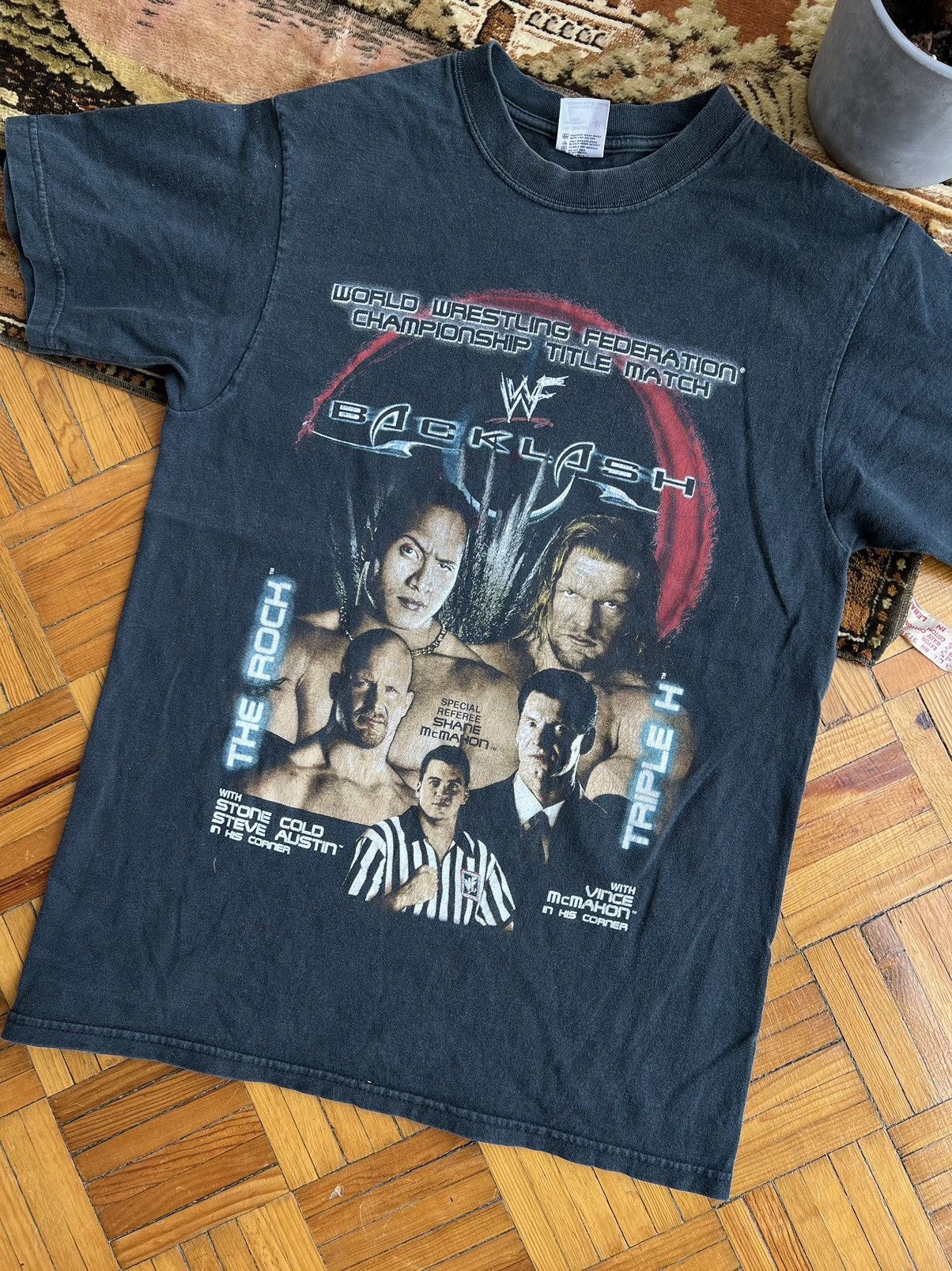 image of Vintage x Wwe 2000 Backlash The Rock Triple H Stone Cold Vince Mcmahon Tee in Black (Size Medium)