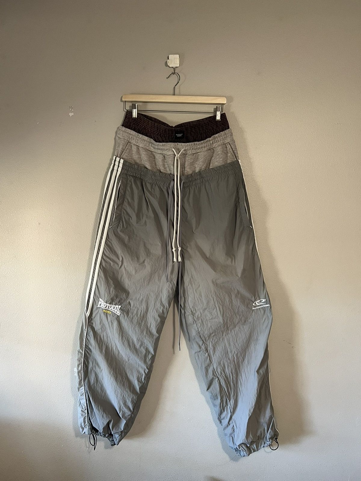 パンツ Protocol Index PROJECT G/R LAYERED PANTS PROJECT G/R Protocol Index 3 LAYERED TRACK PANTS PROJECT GR | Grailed