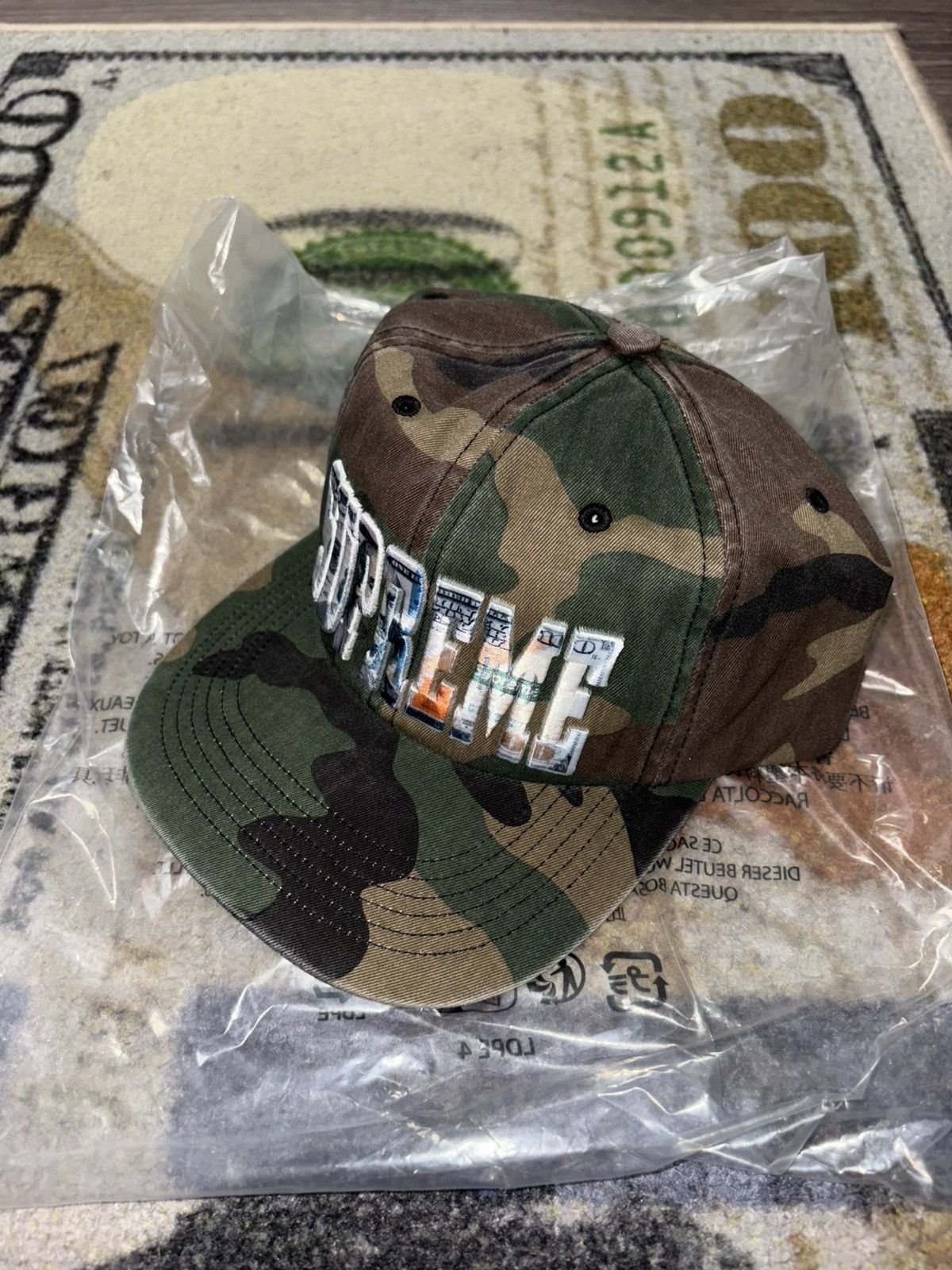 Supreme Embroidered Money Logo 6-Panel Hat Woodland Camo