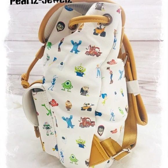 Loungefly Pixar popular Character Allover Print Pin Collector Mini Rucksack