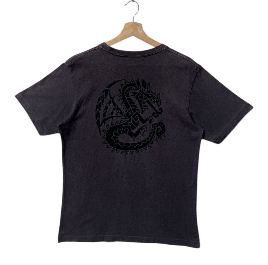 Uniqlo RARE🔥 Capcom Dragon Monster Hunter Size US L / EU 52-54 / 3 - 1 Thumbnail