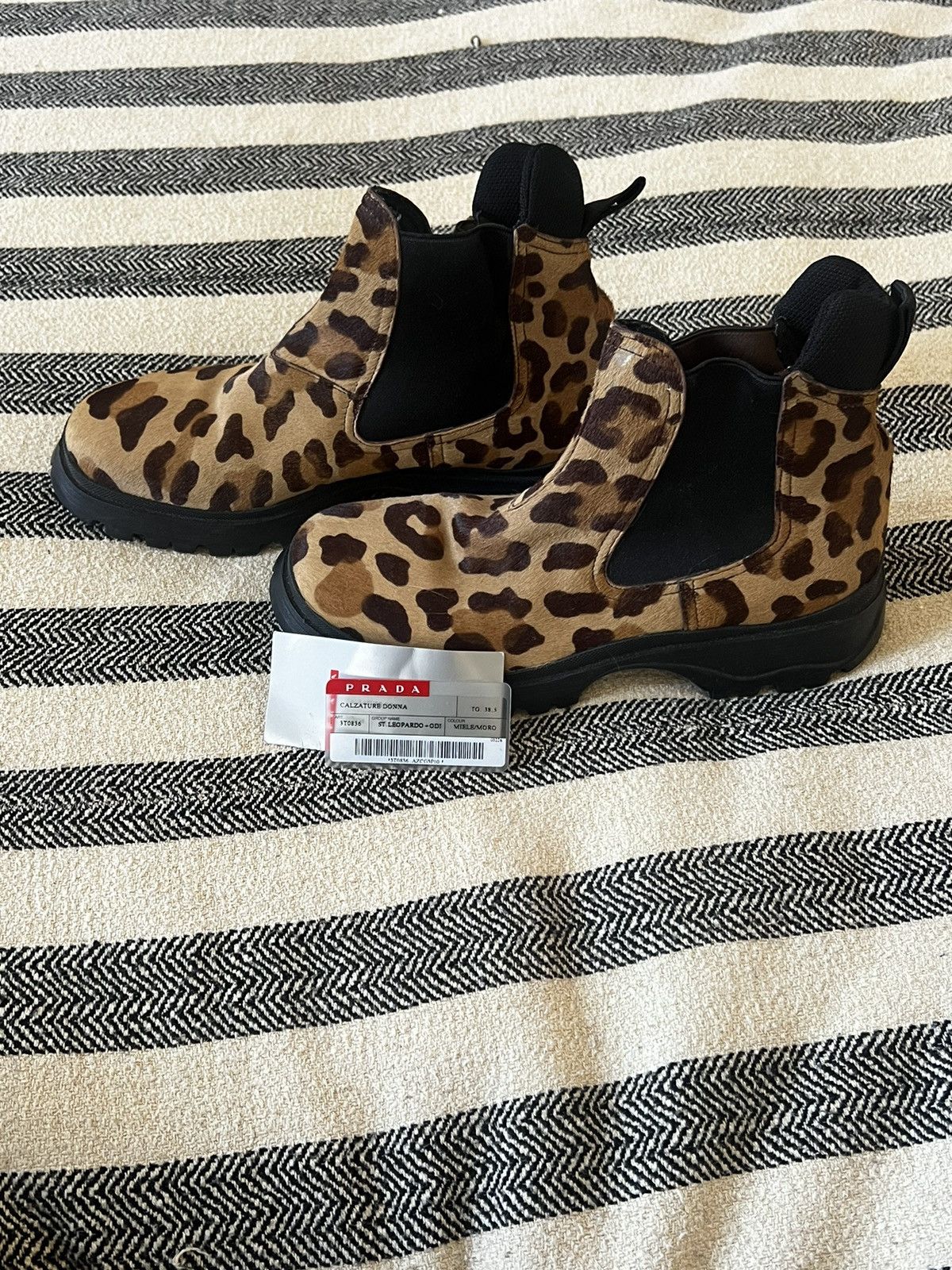 image of Prada Lug Sole Leopard Pony Hair Boots in Black, Women's (Size 8.5)