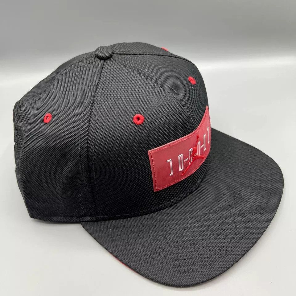 Jordan Brand Air Jordan 11 Hat Men Black Red Jumpman Bred Snap Back Cap Size ONE SIZE - 3 Thumbnail