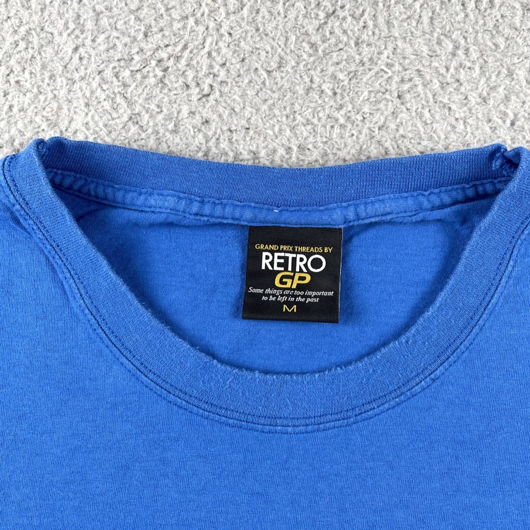 Champion VINTAGE Retro GP Threads Shirt Matra International 1969 Champions Racing Medium Blue Shirt Mens M Blue Retro GP Racing 1960s United Kingdom Size US M / EU 48-50 / 2 - 4 Thumbnail