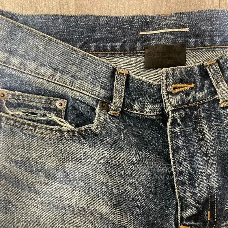 Saint Laurent D02 Distressed Blue Jeans.