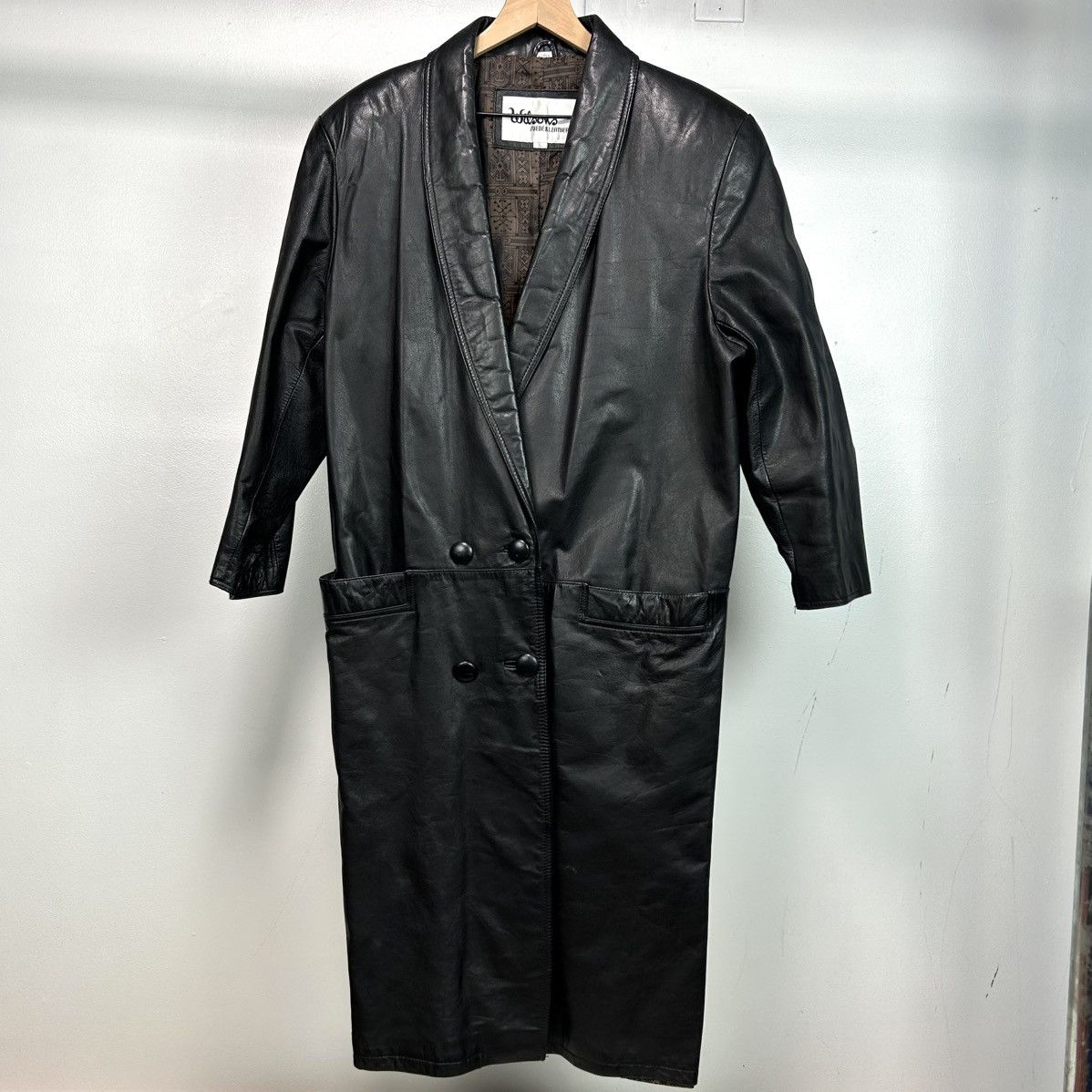 Wilson’s black leather trench coat with double front pockets