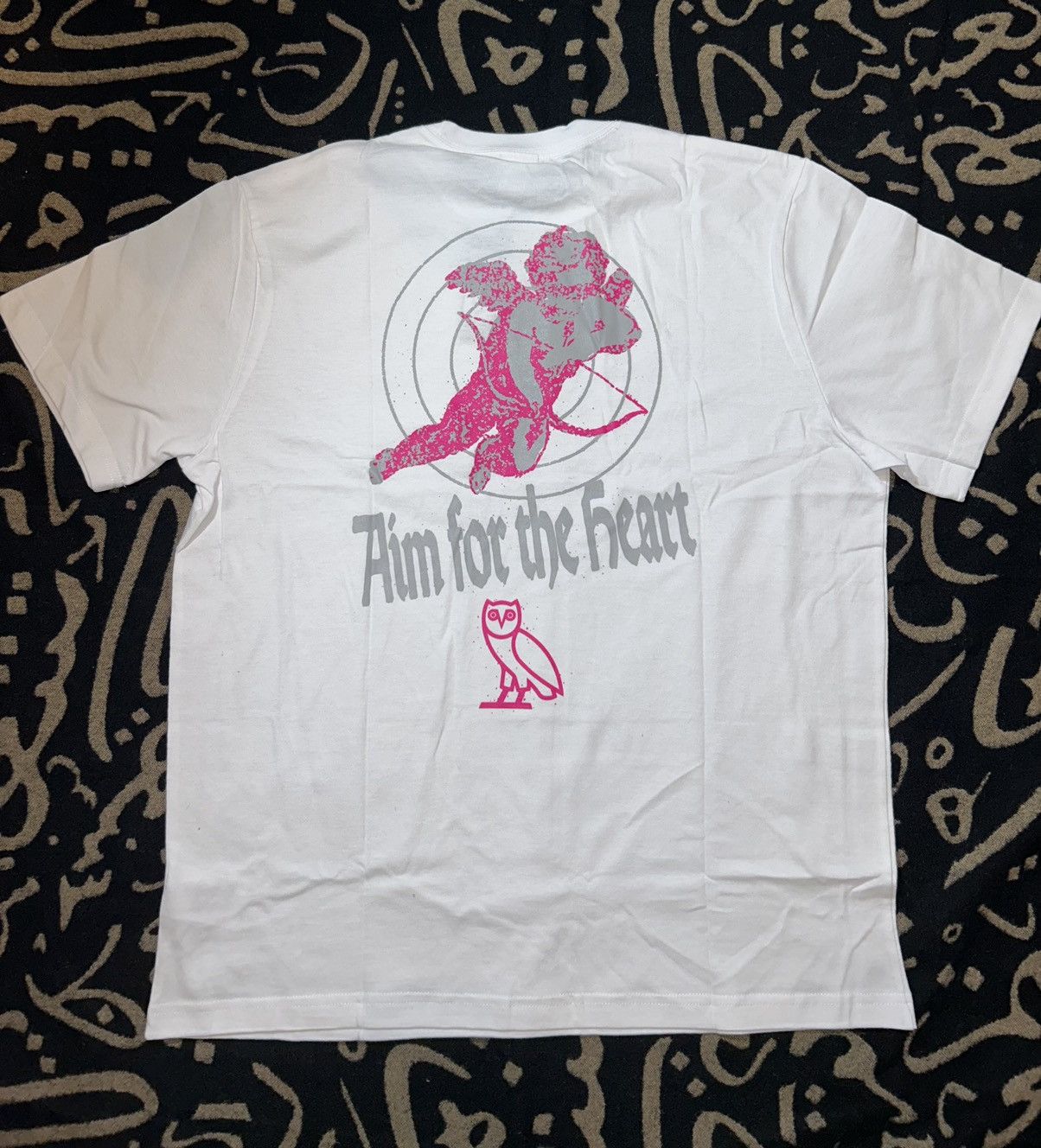 Drake × October's Very Own OVO “Aim For The Heart” Cupid TShirt Size US XL / EU 56 / 4 - 5 Thumbnail