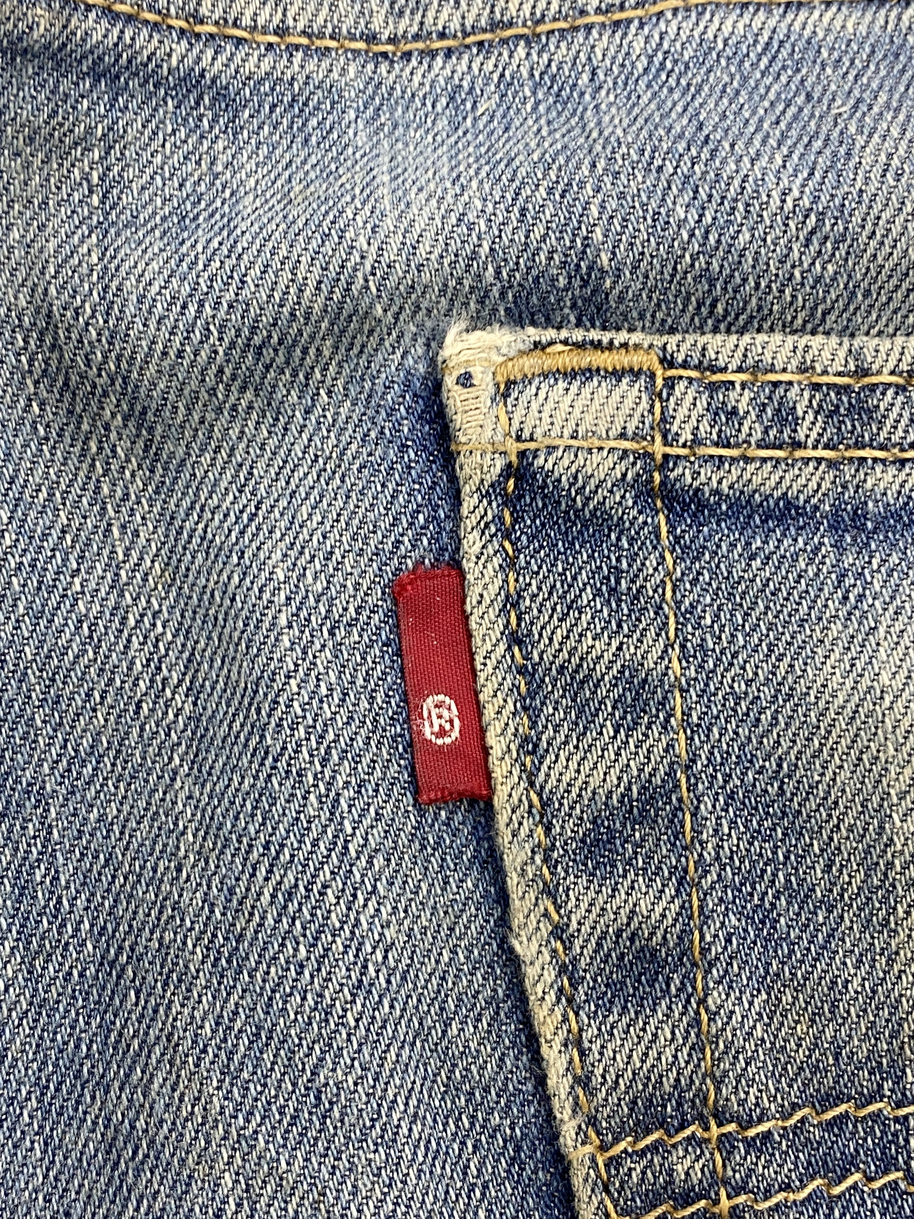 Distressed Vintage Levi's 514 Faded Blue Jeans