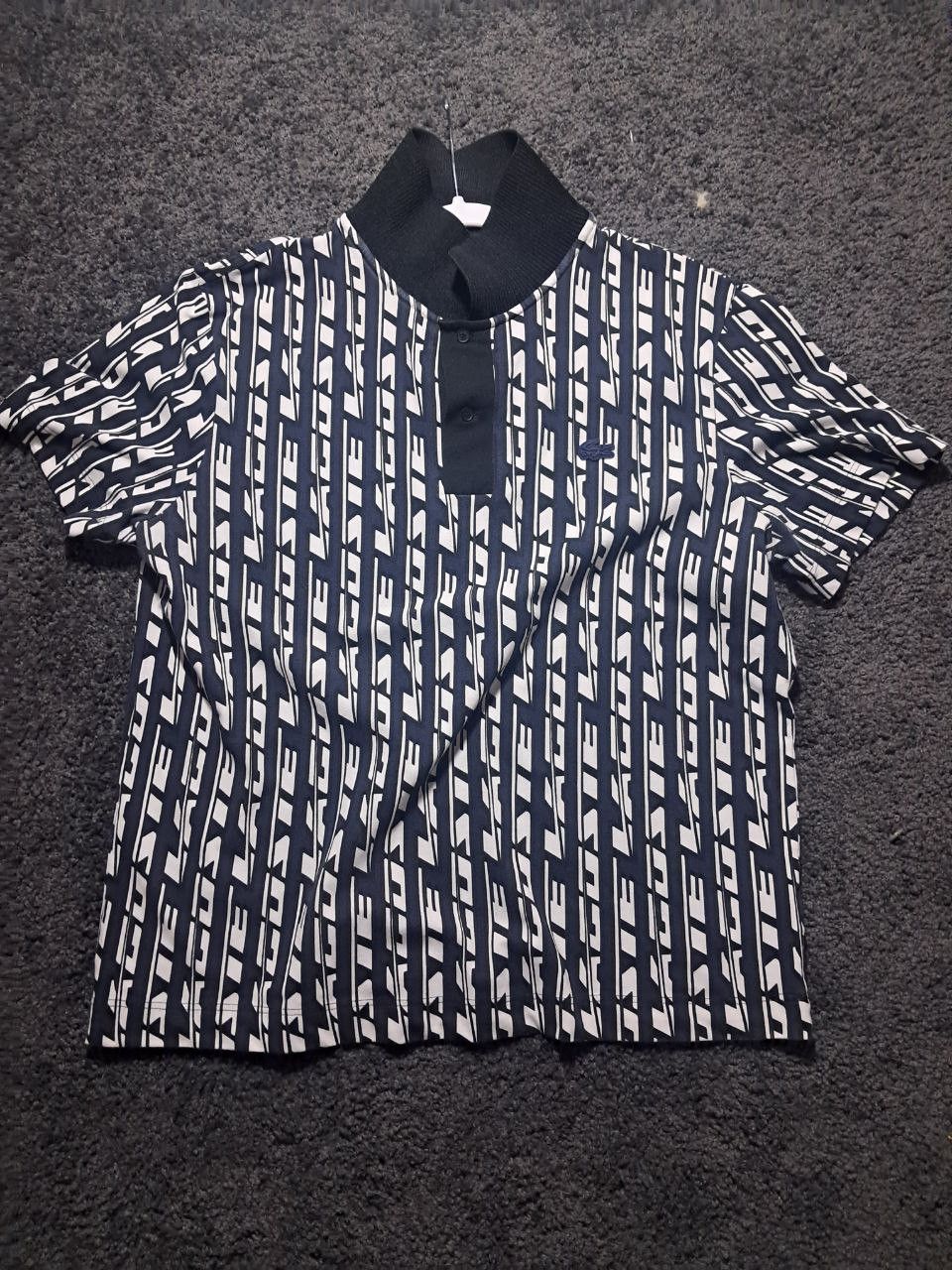 Lacoste Full name: Men’s Navy & White Geometric Print Polo Size US XL / EU 56 / 4 - 1 Thumbnail