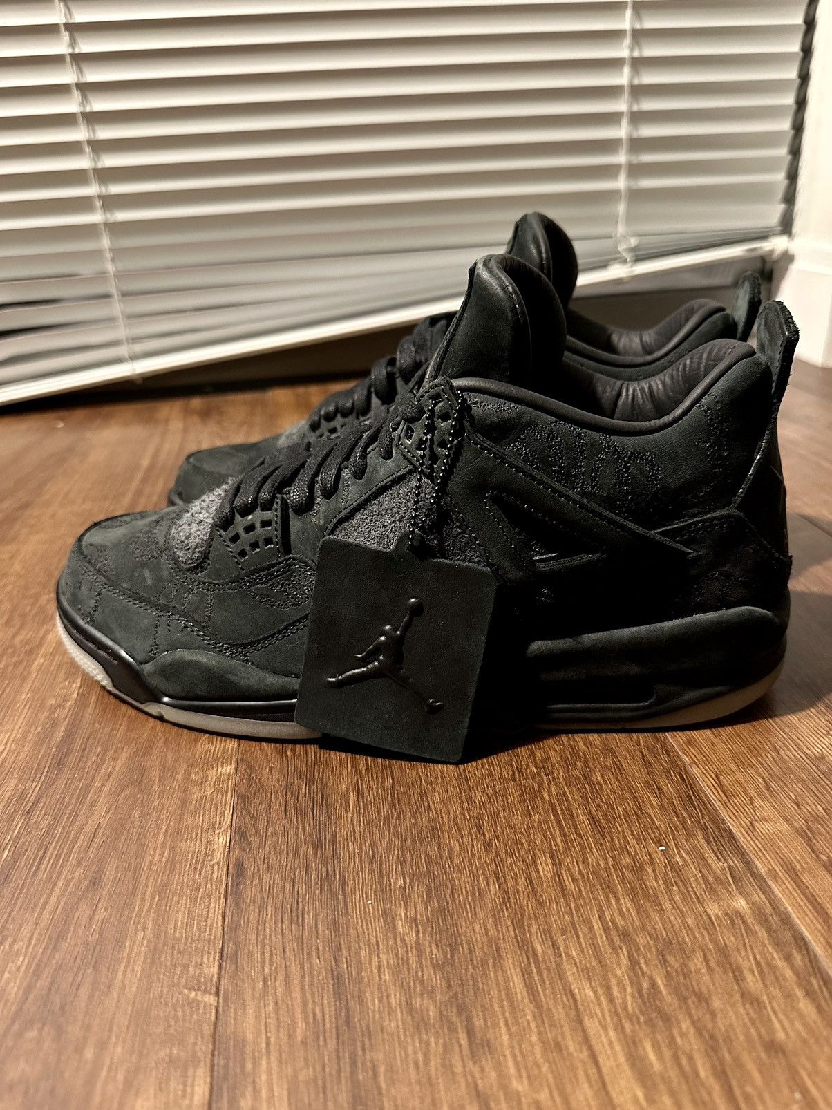 Kaws jordan 4 black deals