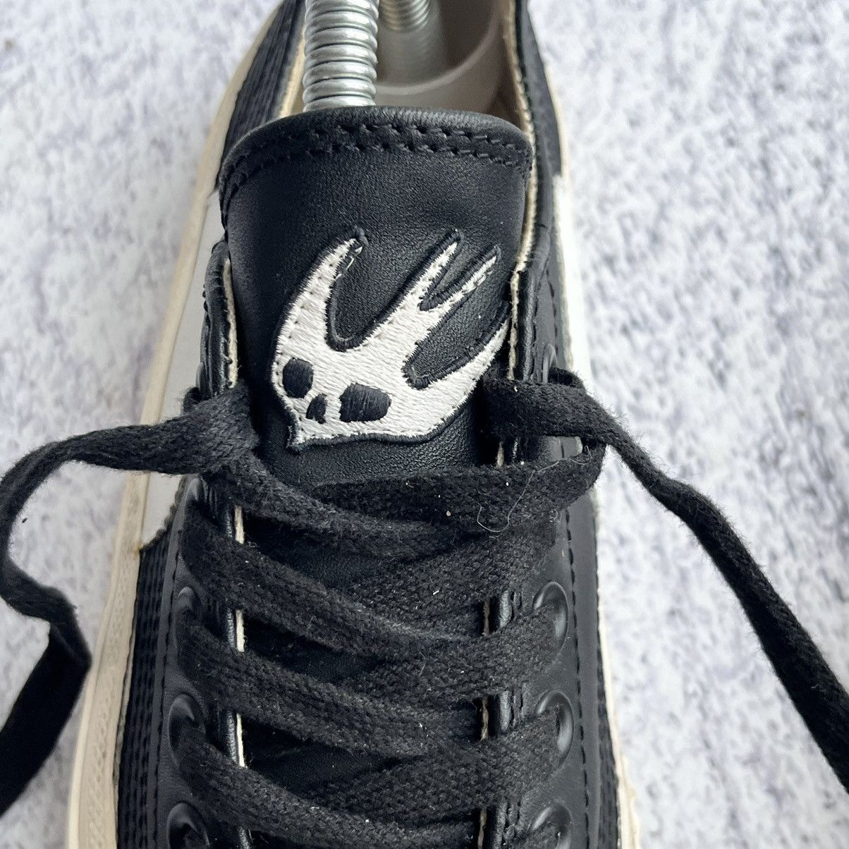 Alexander McQueen Black leather swallow plimsoll sneakers