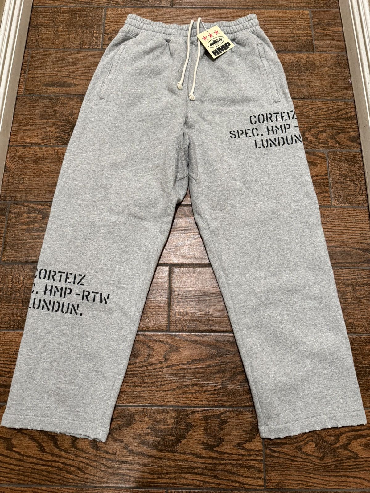 Corteiz Corteiz HMP Stencil Open Hem Sweatpants | Grailed
