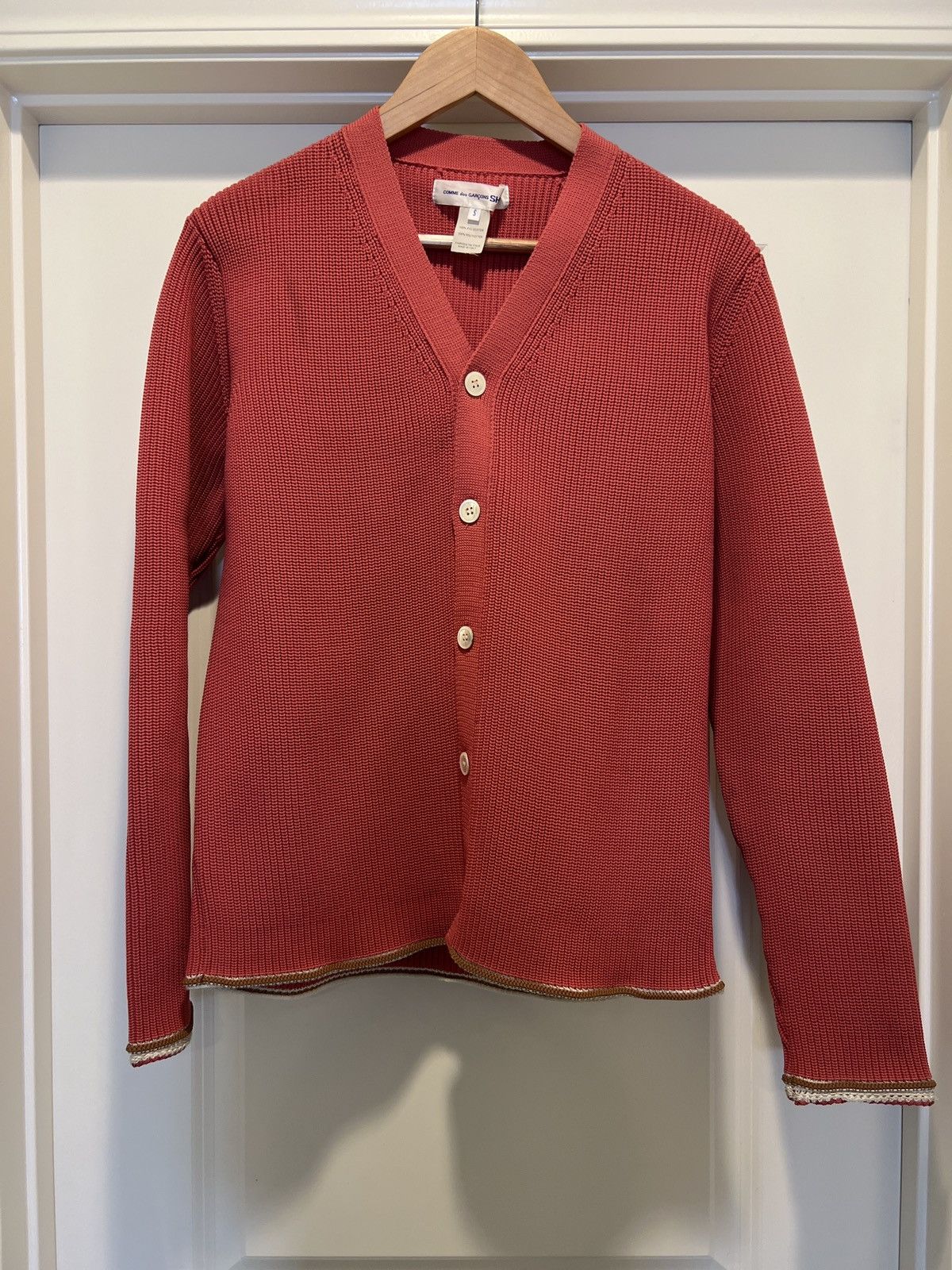 COMME does GARÇONS SHIRT salmon kitted cardigan.