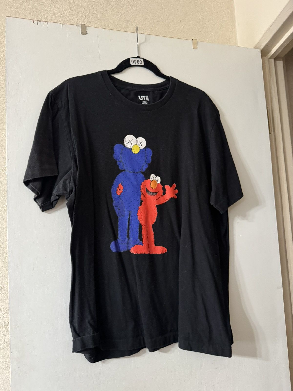 Black Kaws Uniqlo Elmo T-Shirt Blue and Red Graphic.
