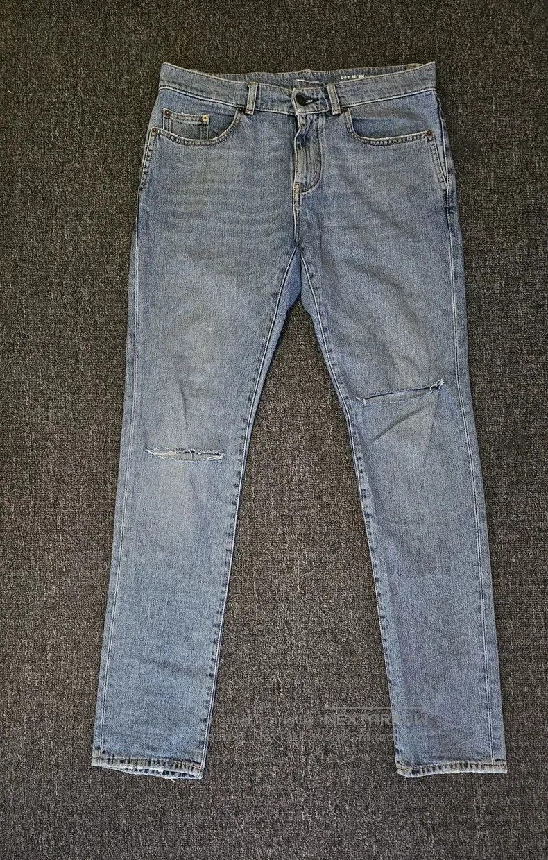 Saint Laurent Distressed Knee Denim Jeans.