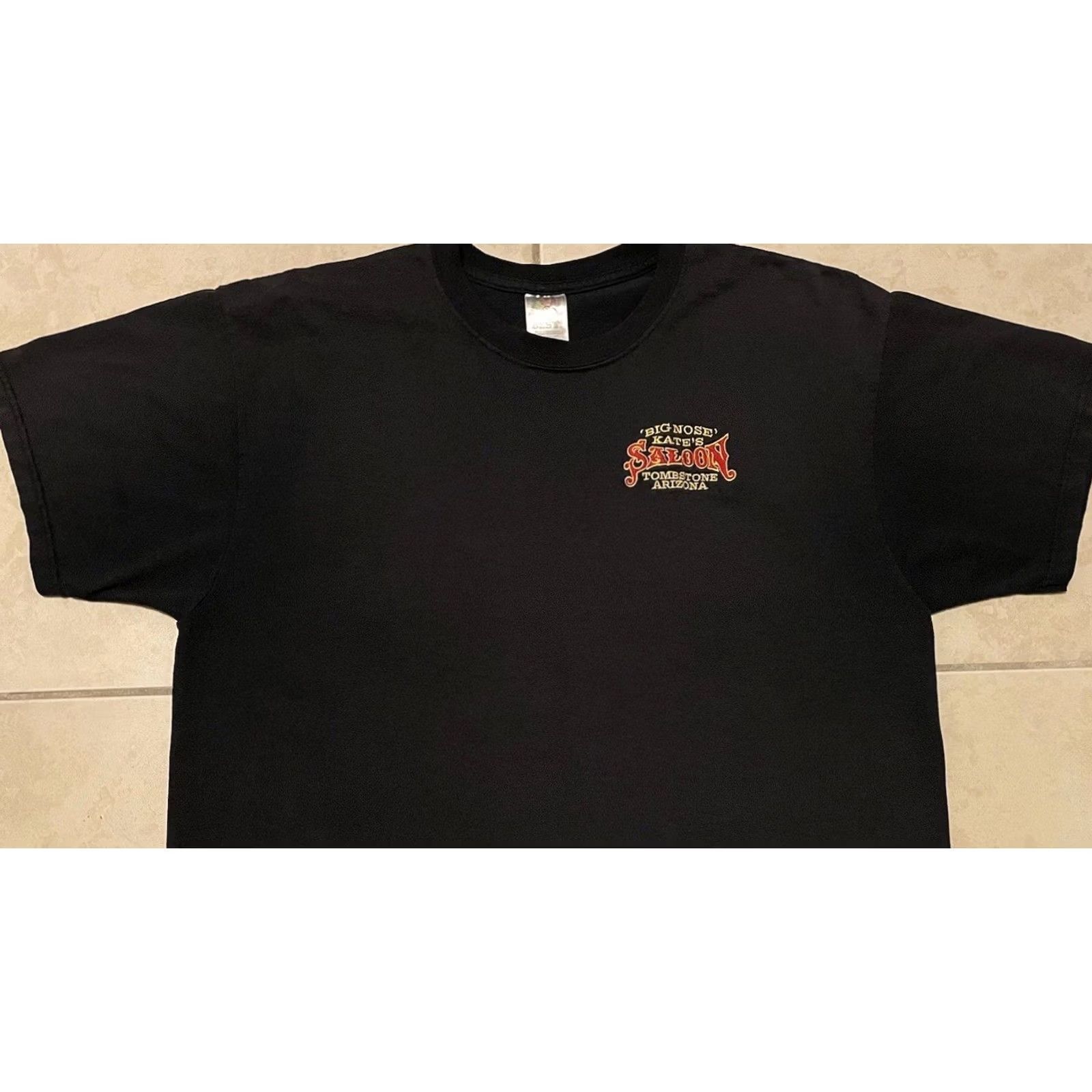 Vintage VINTAGE Big Nose Kates Saloon Tombstone Arizona Faded Shirt XL Black Harley Grunge 80s 90s Bar Joke Humor USA Western Rock Mens T-Shirt Size US XL / EU 56 / 4 - 7 Thumbnail