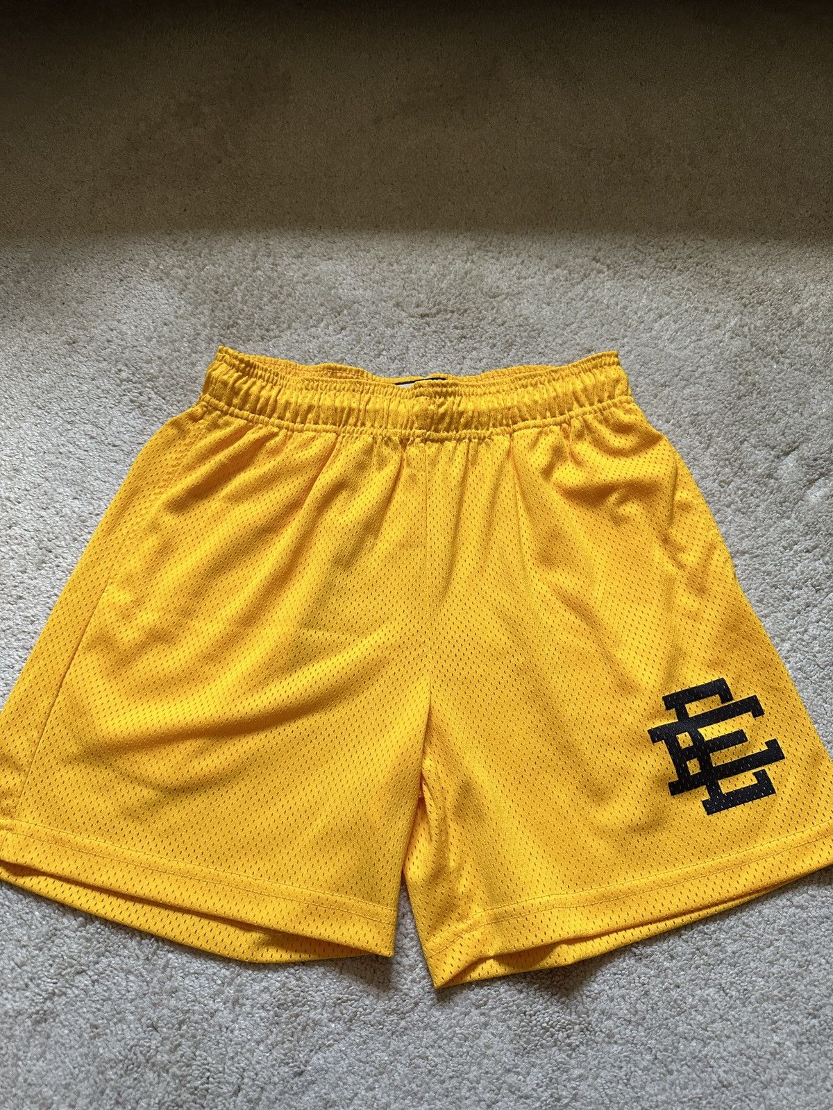 Eric Emanuel Eric Emanuel Yellow Black Logo shorts | Grailed