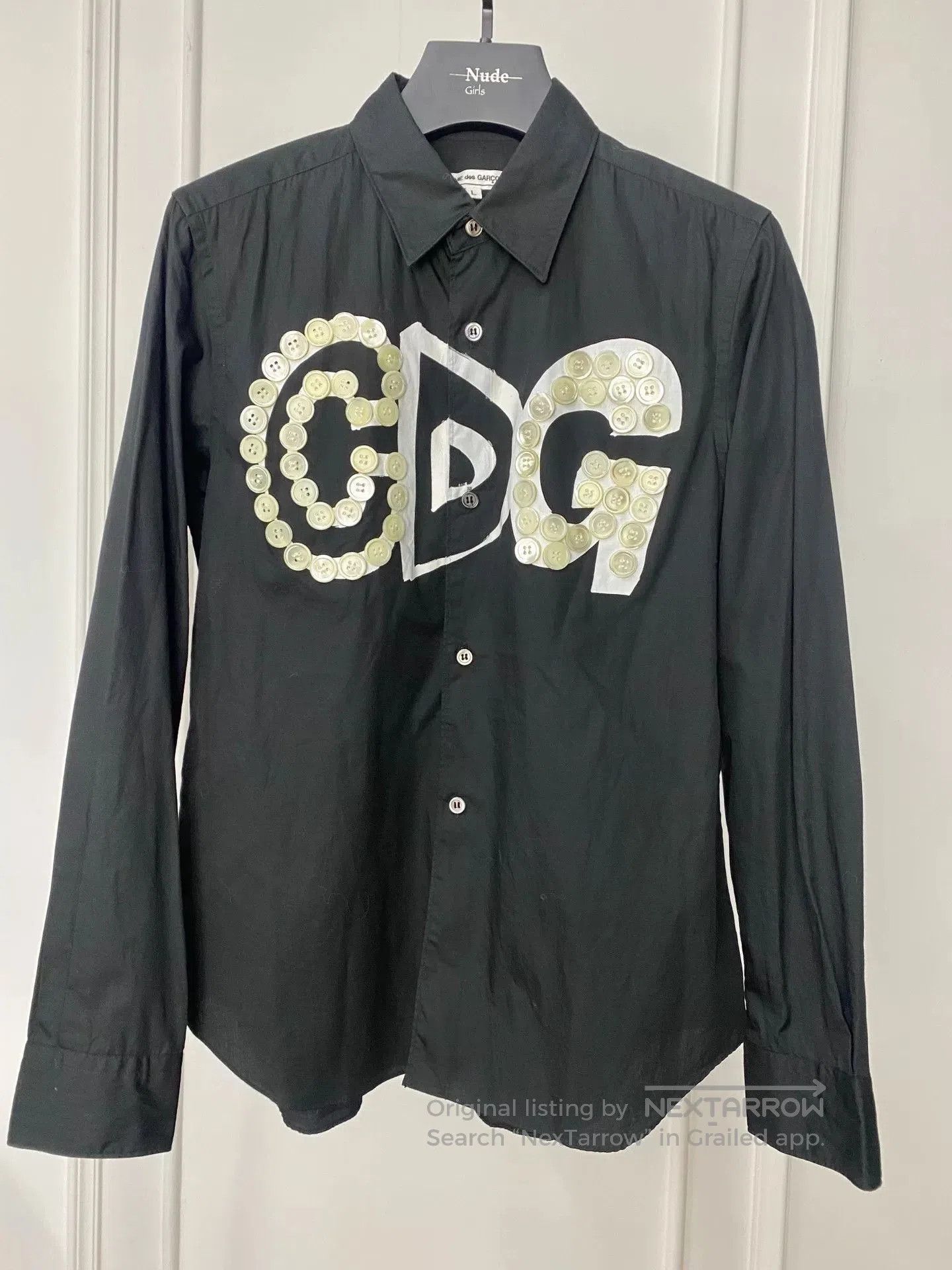 comme des garcons button-up shirt in black.