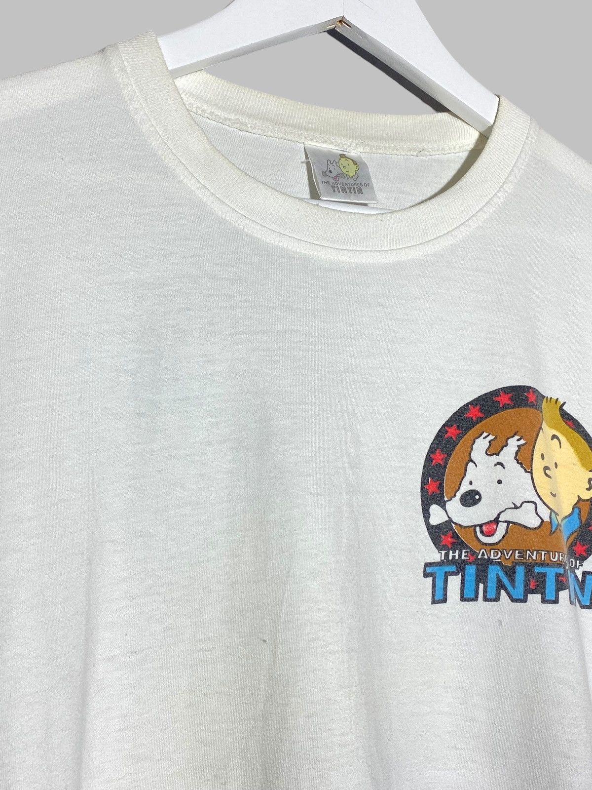 Cartoon Network 🔥 TINTIN IN AMERICA 90s GRAPHIC TEE USA INDIGENOUS VIBES Size US M / EU 48-50 / 2 - 6 Thumbnail