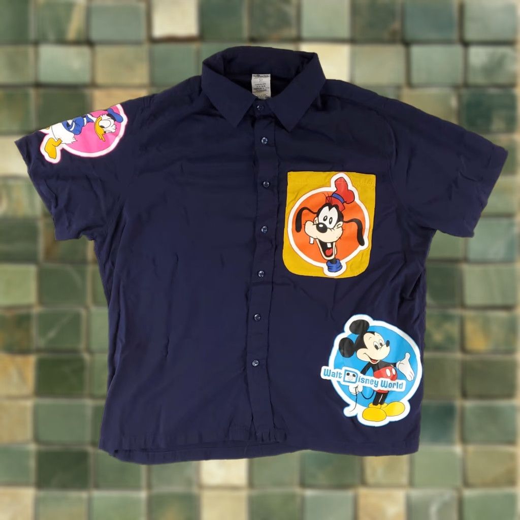 Disney **WALT DISNEY MEN'S XL BLUE VINTAGE BUTTON UP SHIRT** User: **WALT DISNEY MEN'S XL BLUE VINTAGE BUTTON-UP SHIRT** Size US XL / EU 56 / 4 - 1 Thumbnail