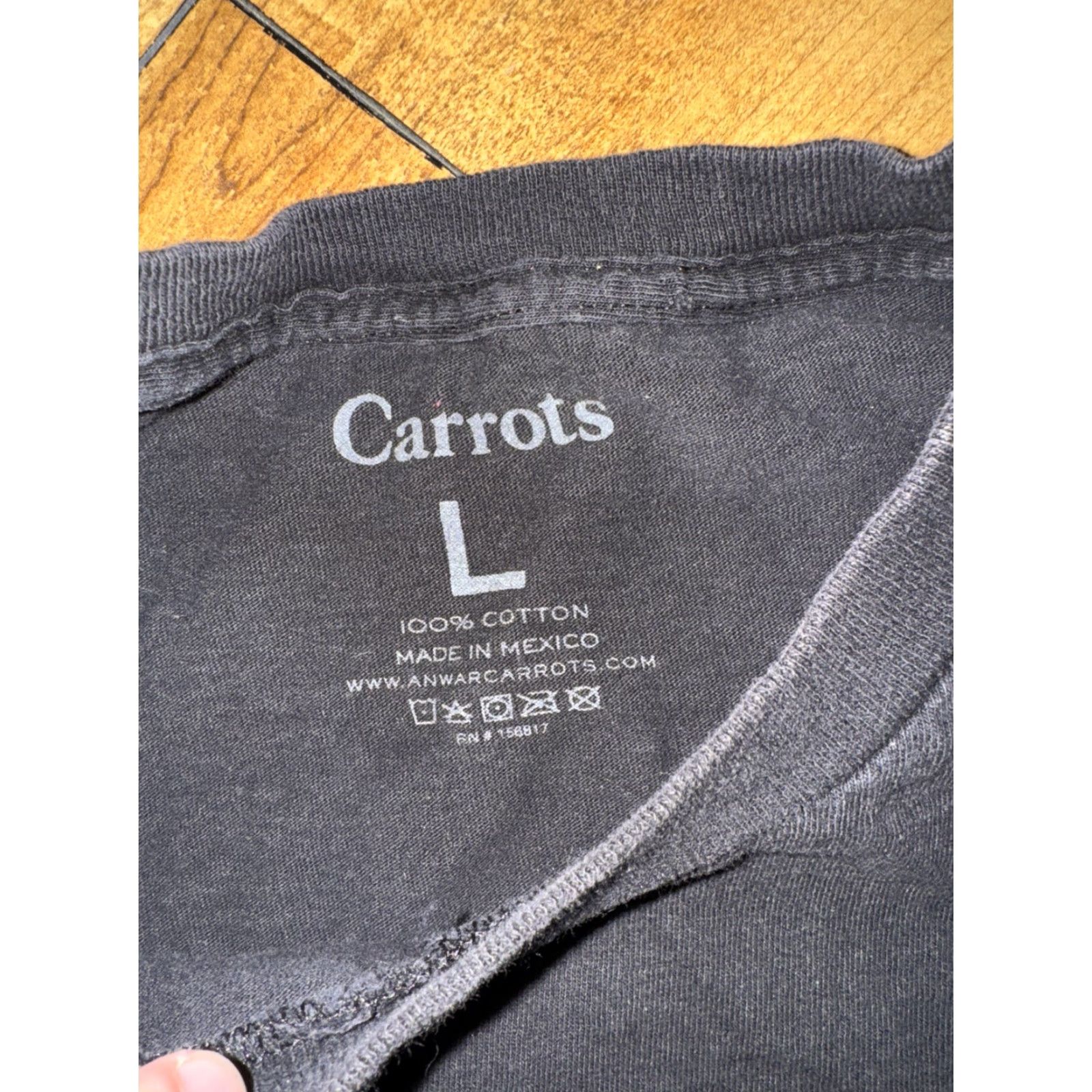 Vintage **Anwar Carrots Black Large Graphic T-Shirt** User: Anwar Carrots Black Large Graphic T-Shirt Size US L / EU 52-54 / 3 - 8 Thumbnail