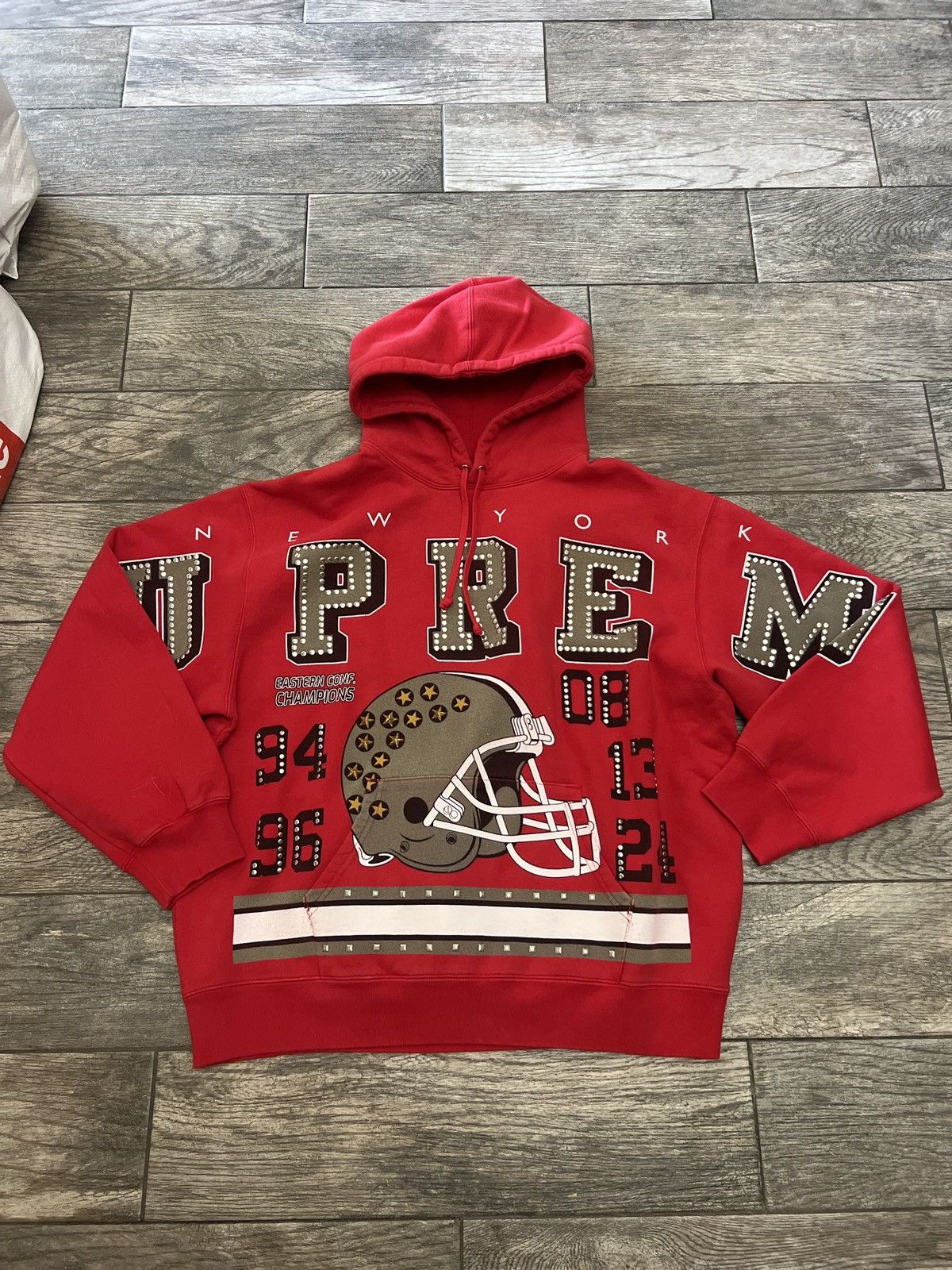 Supreme Supreme champions studded hooded sweatshirt | Grailed