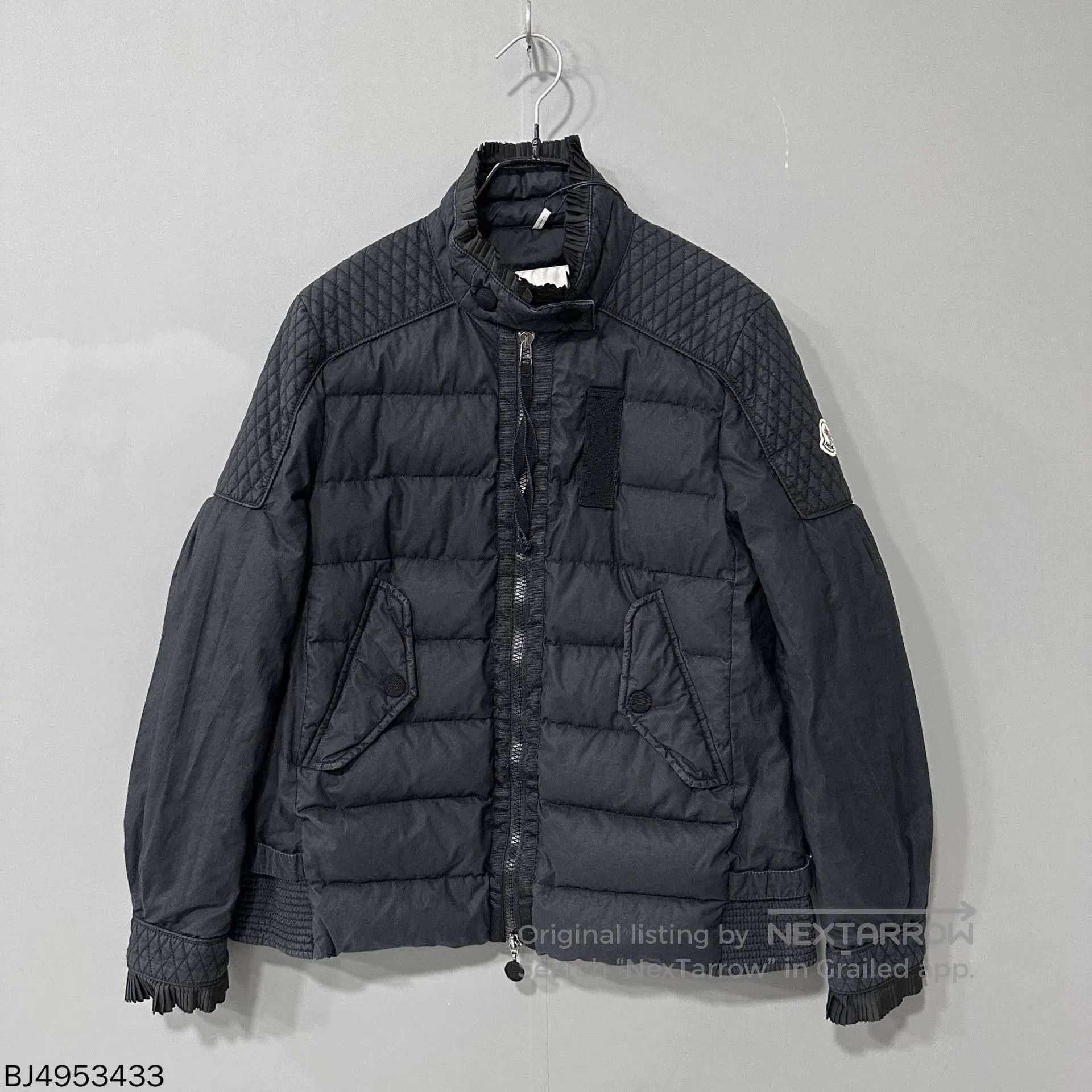 black zip-down puffer coat Moncler.