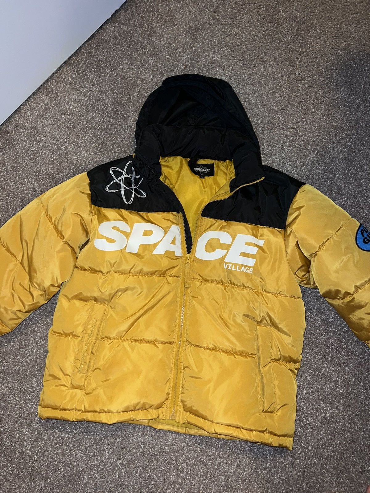 image of Travis Scott Space Village Puffer Jacket in Yellow, Men's (Size Small)