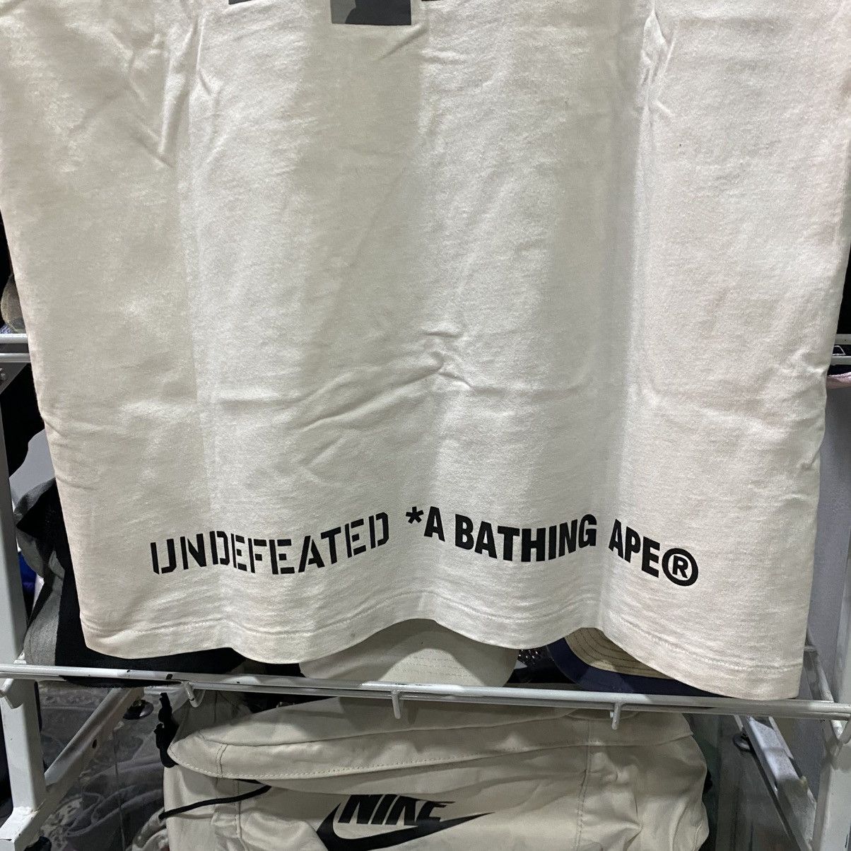 Bape × Undefeated BAPE x UNDEFEATED 5 STRIKES BIG HEAD CAMO TEE Size US L / EU 52-54 / 3 - 7 Thumbnail