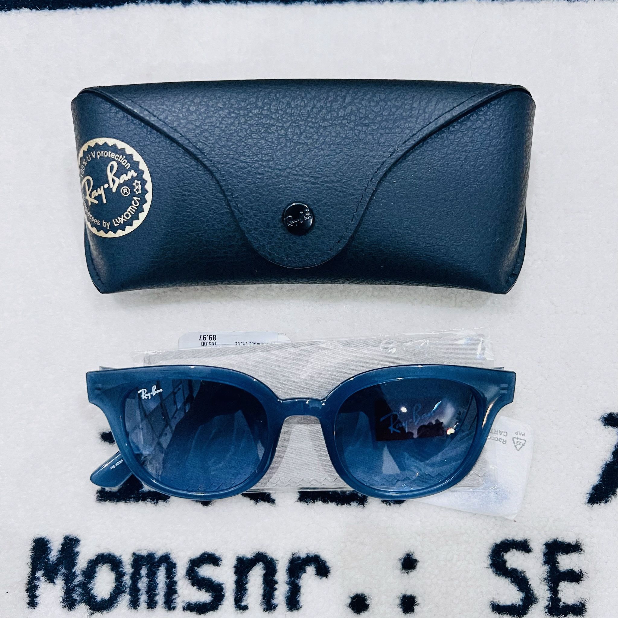 RayBan RayBan RB4324 Transparent Dark Blue Cat Eye Sunglasses Size ONE SIZE - 1 Thumbnail
