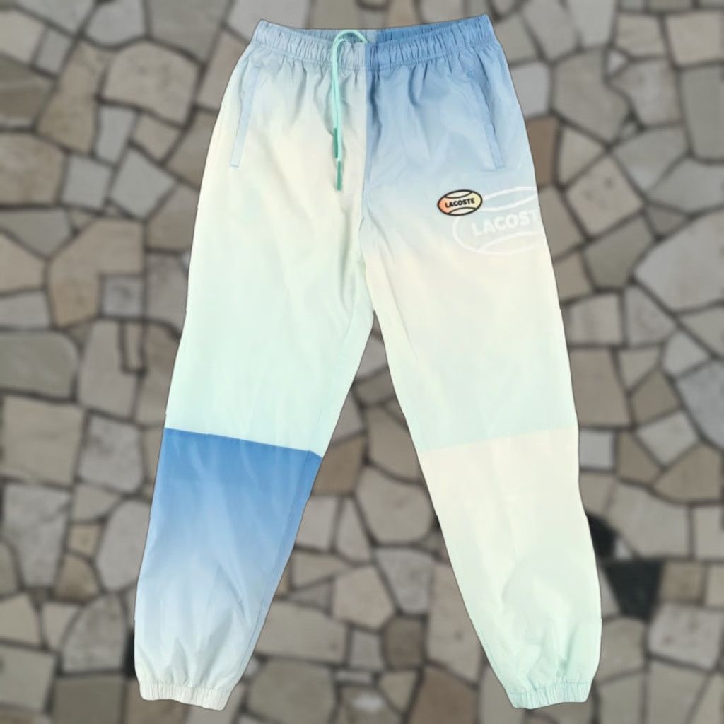 Lacoste Lacoste Live Gradient Print Polyester Shell Windbreaker Pants Multi-Colored Men's XS Windbreaker Pants Lacoste Live Gradient Print Men's XS Size US 27 - 1 Thumbnail
