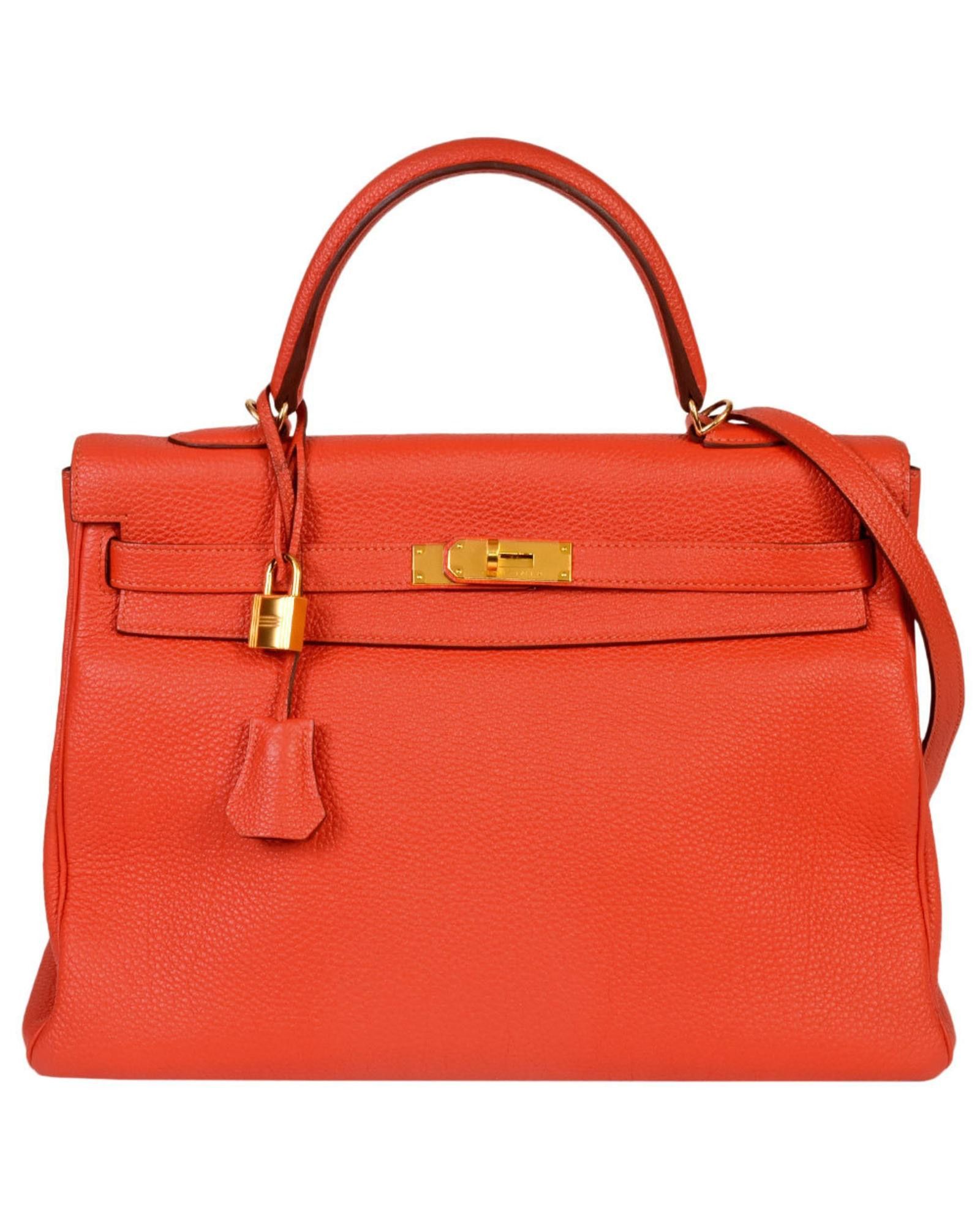 image of Hermes Iconic Orange Leather Handbag With Classic Charm, Women's
