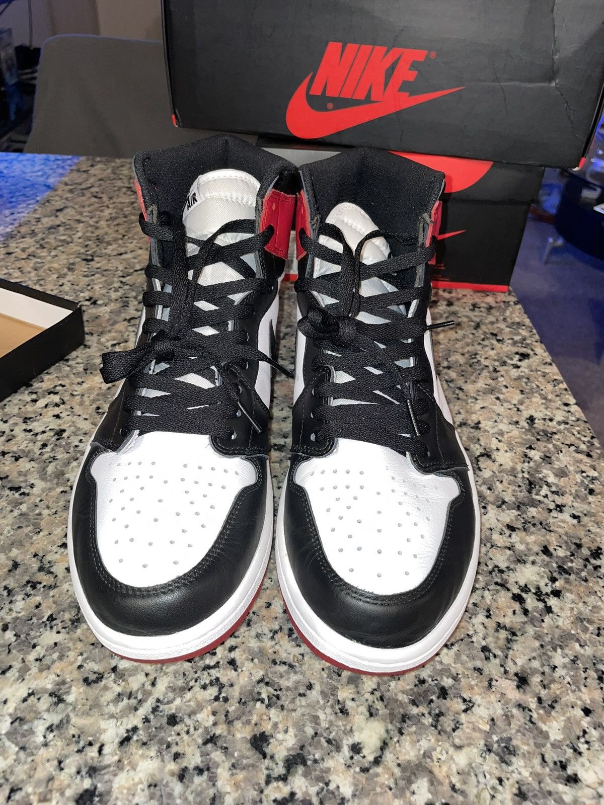 image of Air Jordan 1 Black Toe Shoes in Red, Men's (Size 12)