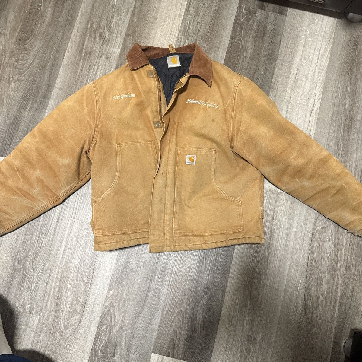 Carhartt workwear jacket with custom embroidery.