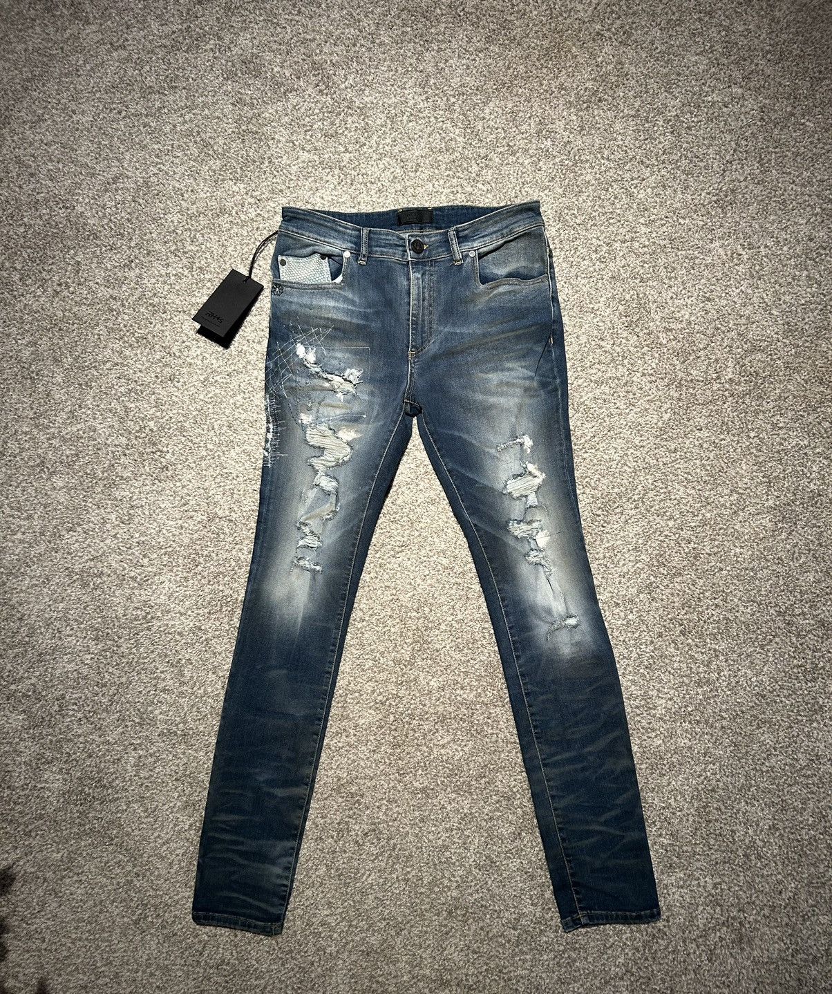 “RH45” Blue distressed skinny jeans with snake skin accents