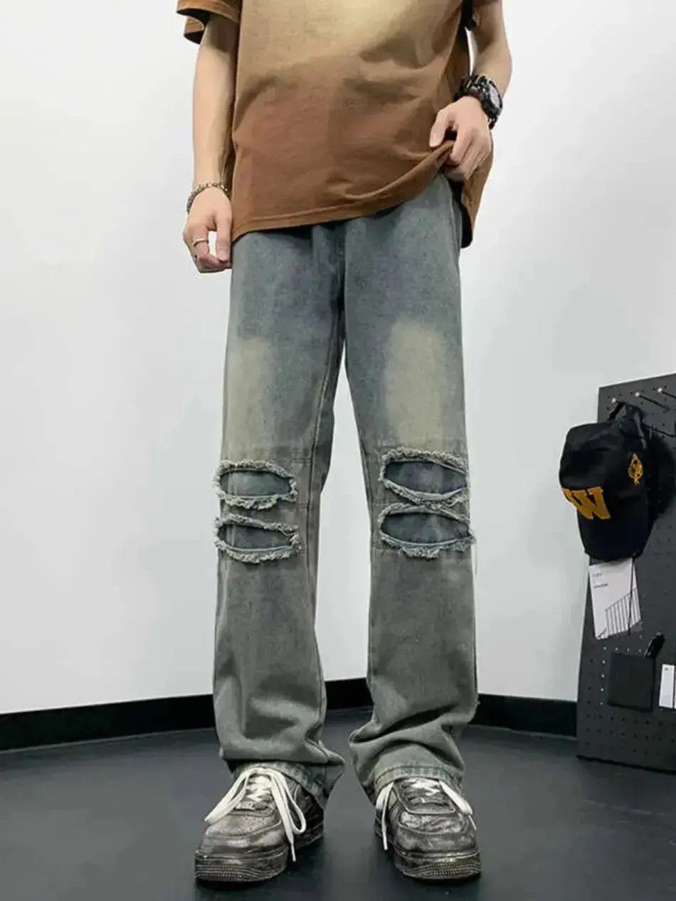 Straight and loose washed distressed jeans