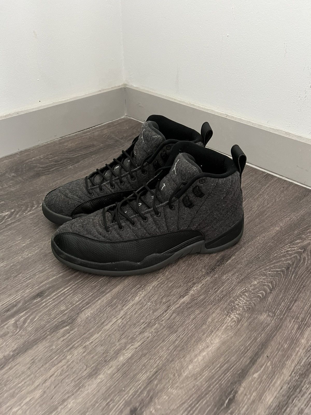 image of Jordan Nike Jordan Retro 12 Wool Shoes in Black, Men's