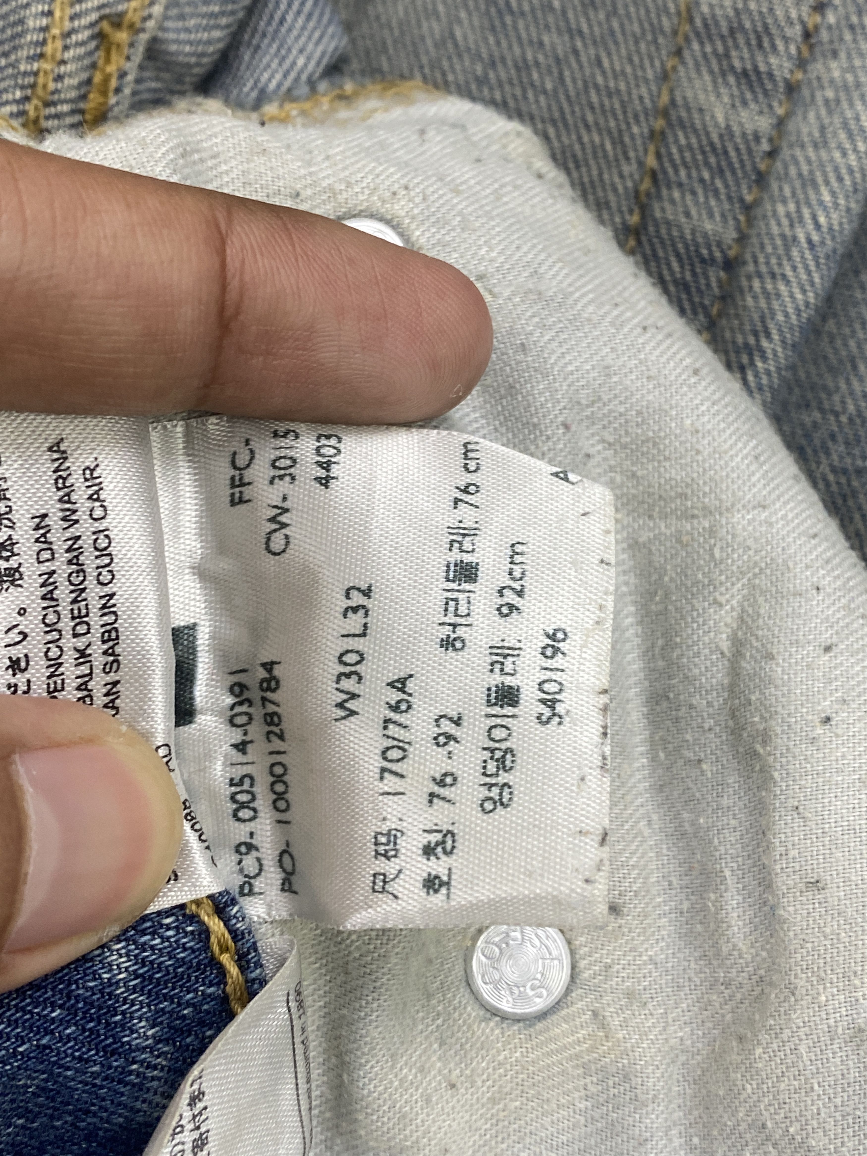 Distressed Vintage Levi's 514 Faded Blue Jeans