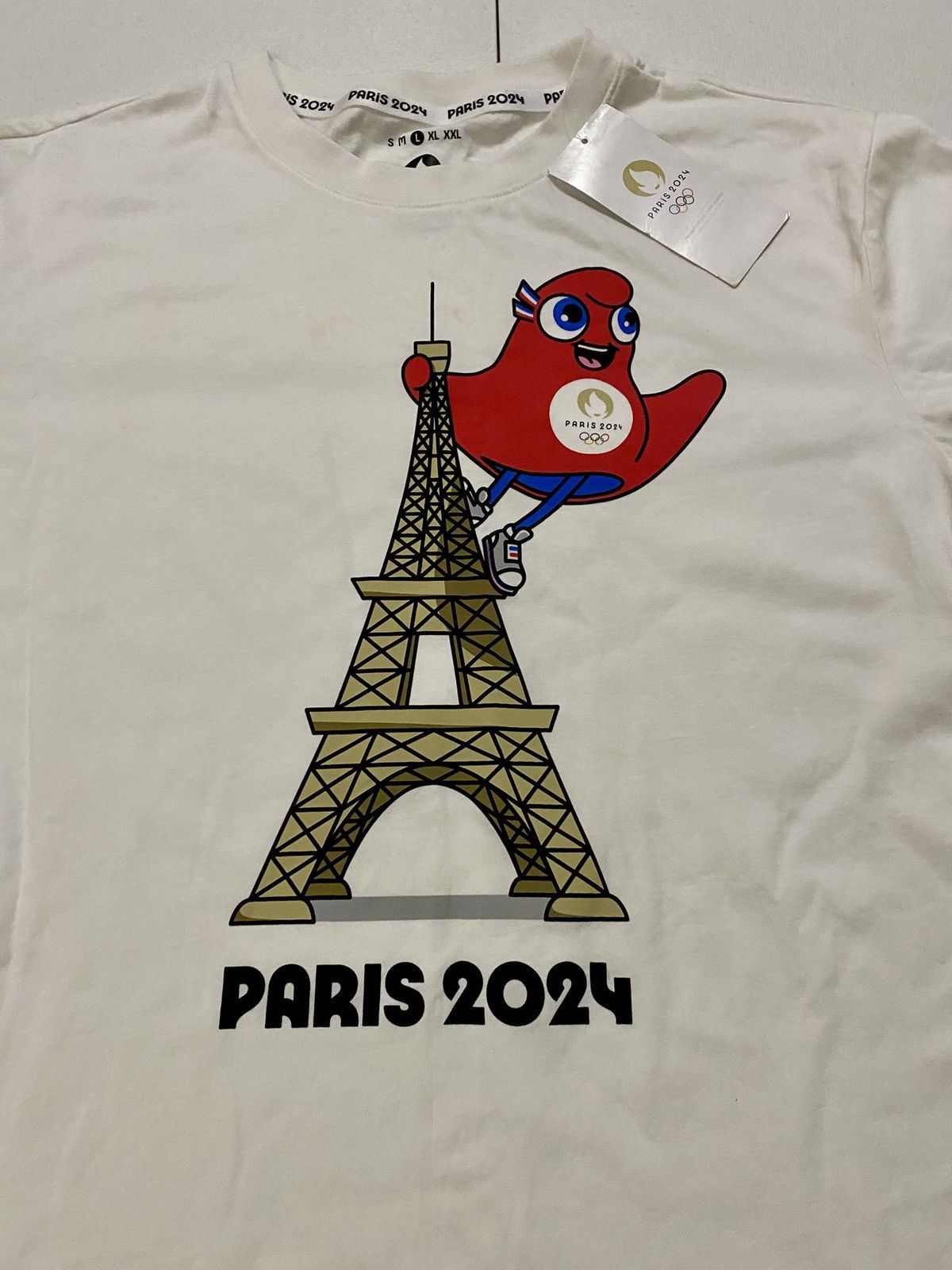 Other Paris Olympics 2024 Eiffel Tower Phryge Mascot Official Tee Size US L / EU 52-54 / 3 - 4 Thumbnail