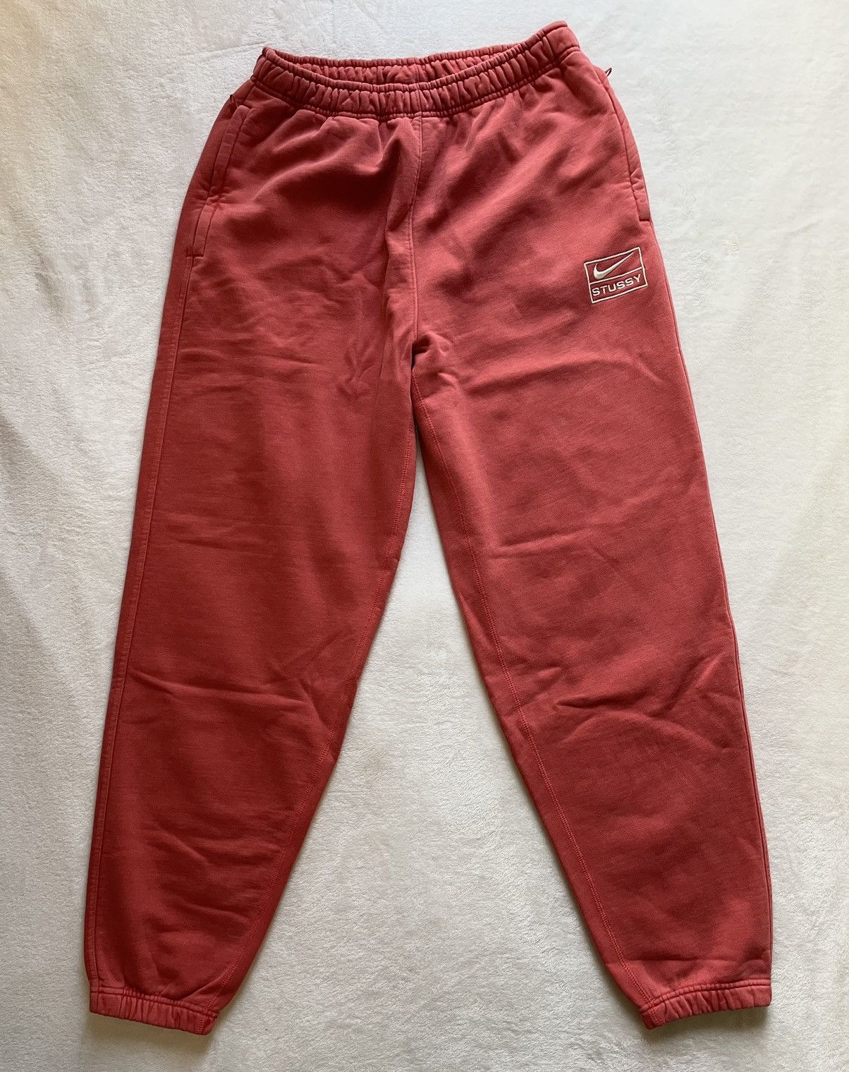 image of Nike Stussy Dyed Pant S in Red, Men's (Size 34)