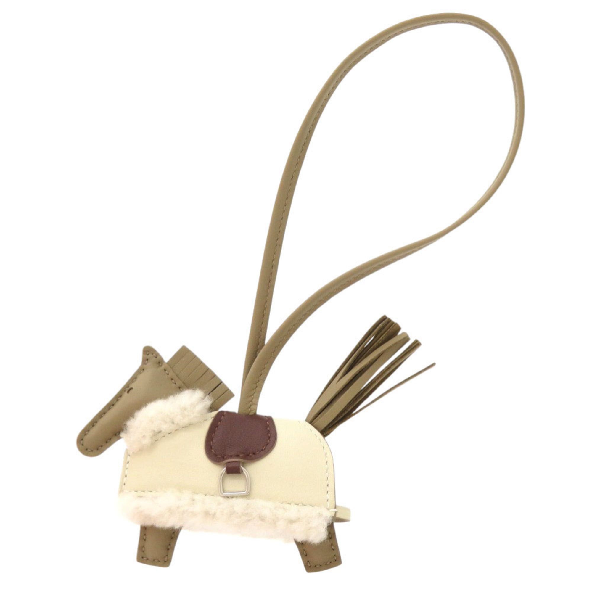 Hermes Hermes Robeo Plush PM, Veau Swift shearling, Anion beige, Malfa, Clé Terre, Ecru, K stamp (2025 production), accessory, bag charm, 0478 HERMES Rodeo PM Size ONE SIZE - 1 Thumbnail