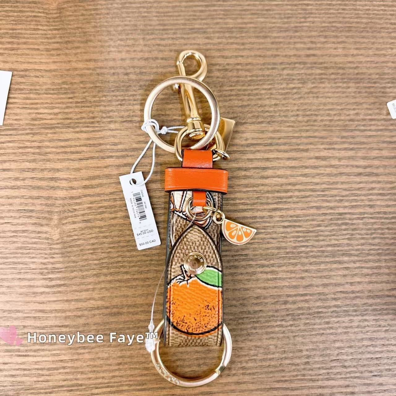 Coach Trigger Snap Bag Charm In Signature Canvas With Orange Print Size ONE SIZE - 1 Thumbnail